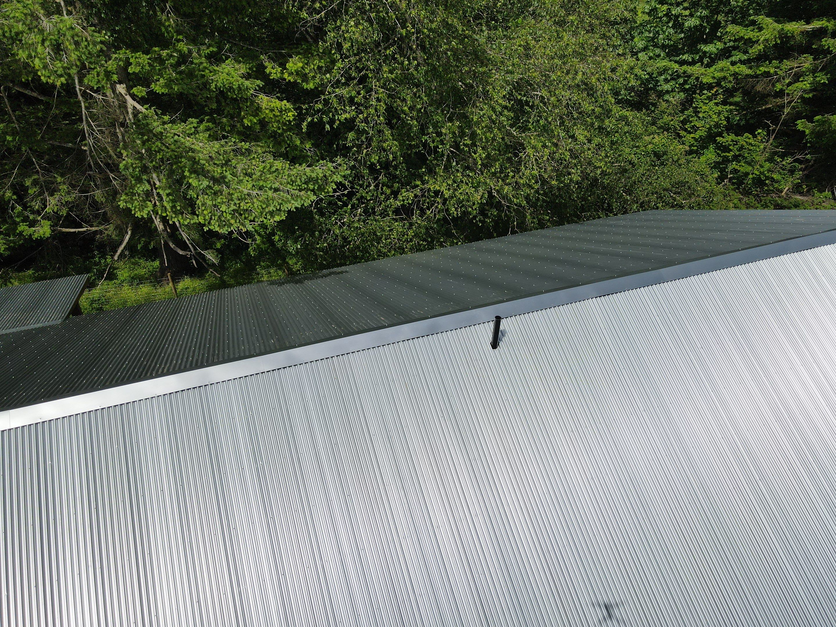 Commercial Roofing Installation using corrugated metal by Top Notch Roofing Inc