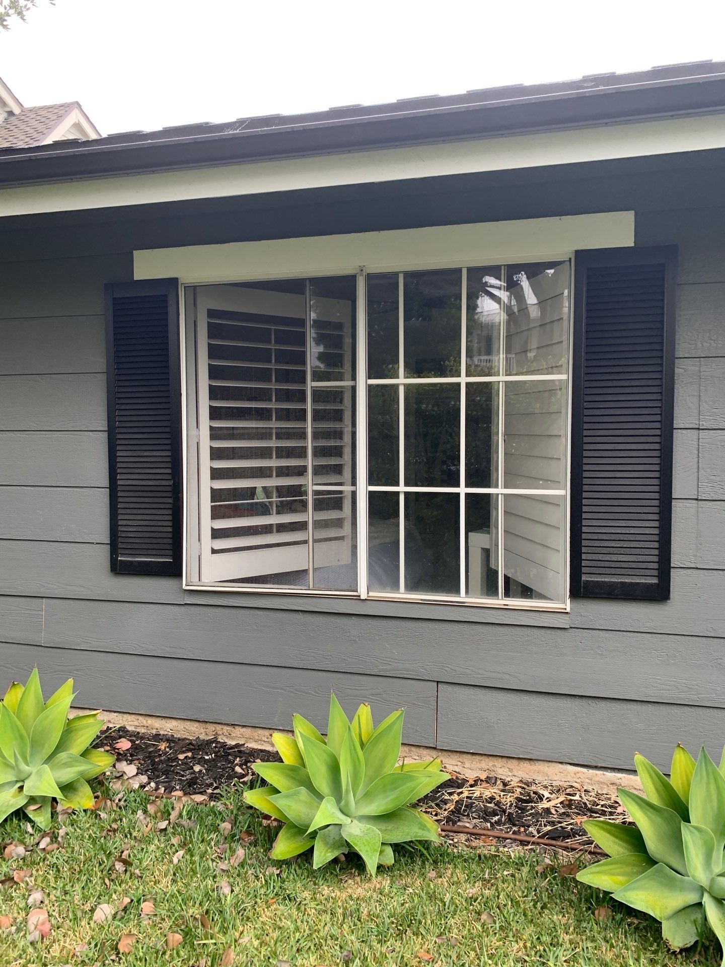 Window Installation using Milgard black vinyl windows by American Window Company
