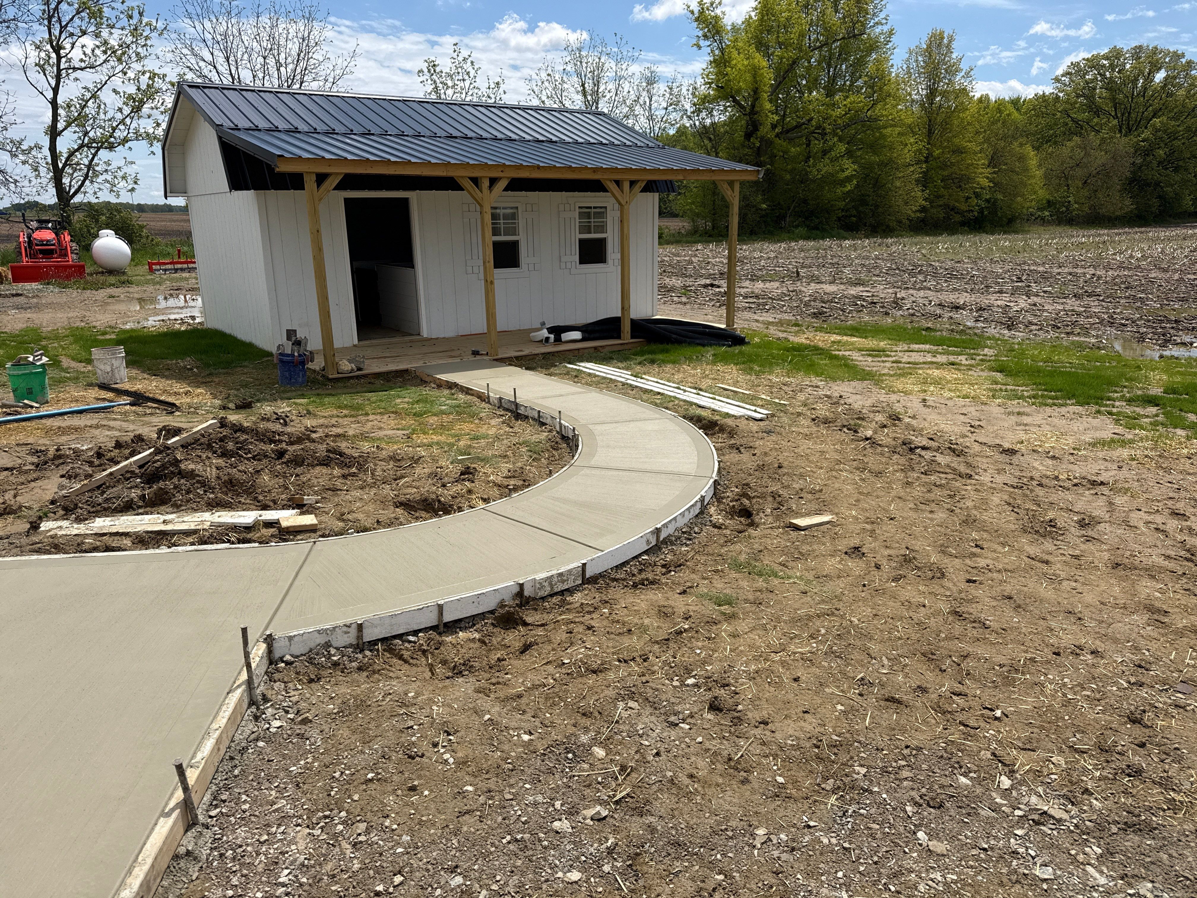 Custom Residential Concrete Walkways and Drainage Installation in Waldo by Concrete One Construction