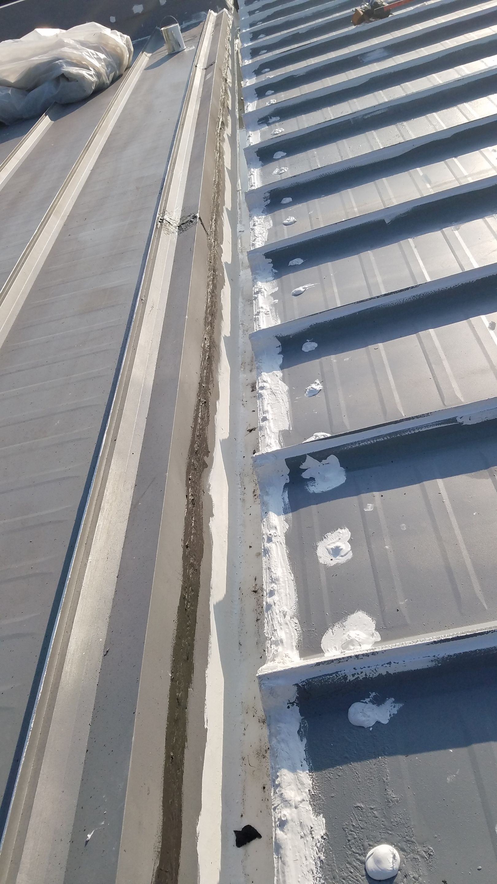 Commercial Metal Roof Coating by Gold Star Roofing LLC