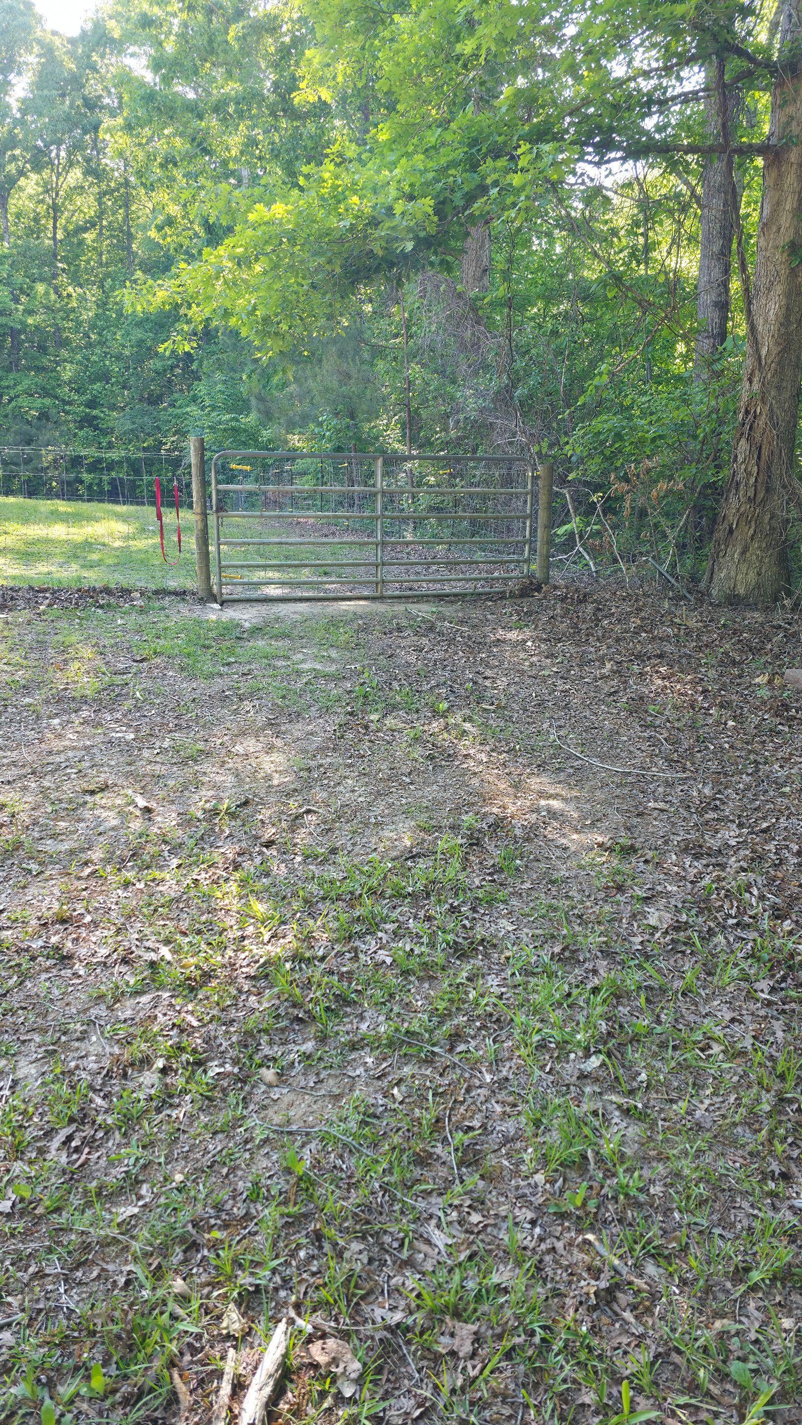 Fence Installation of a 4 Rail Ranch Style Fence with Welded Wire by Titans of Timber Fence & Stain