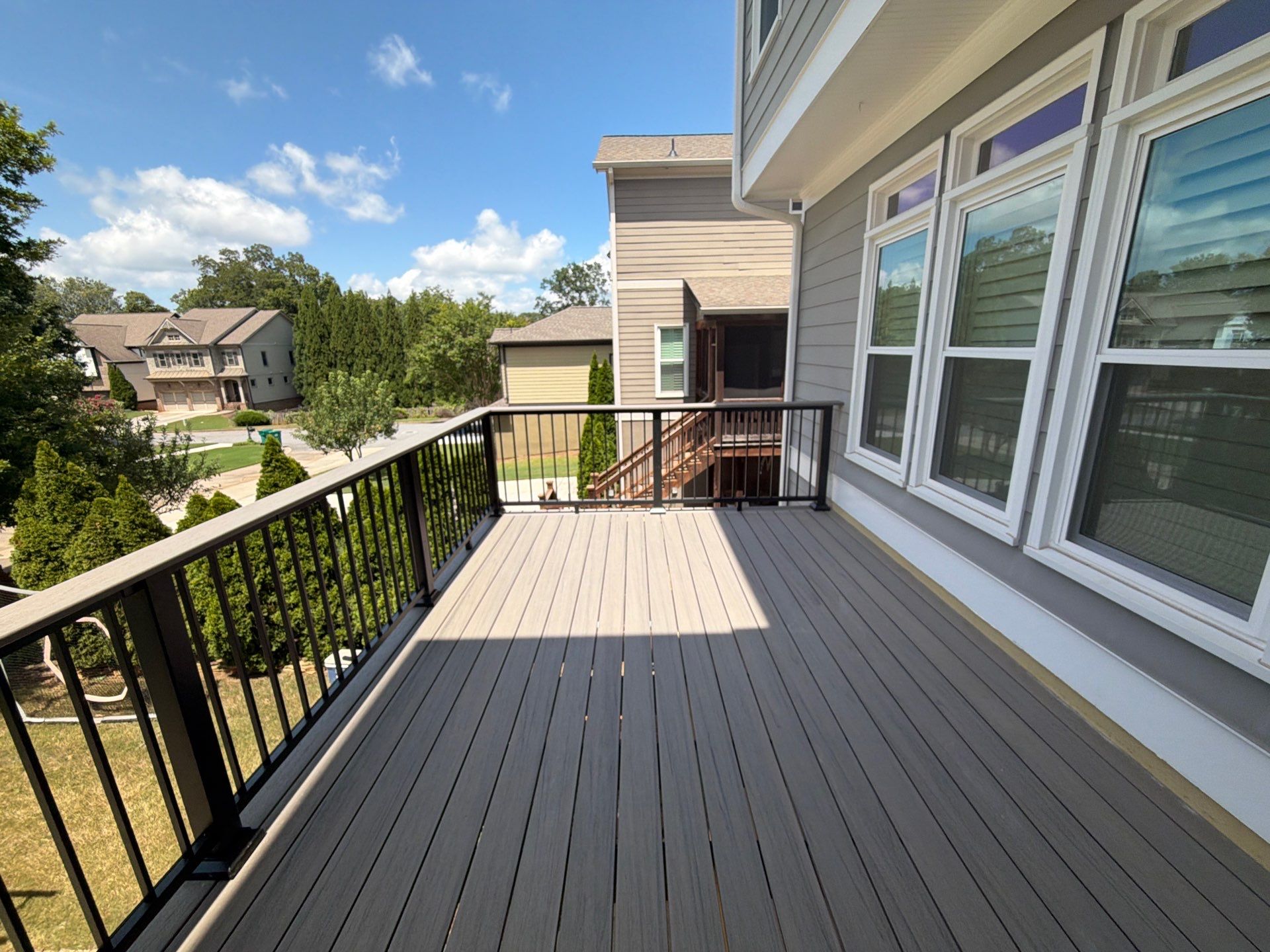 Elevated Composite Deck Replacement with Metal Railings in Smyrna by Swift Home Renovations 