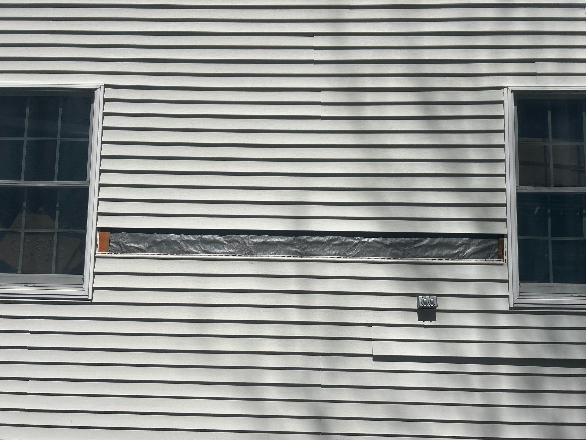 Vinyl Siding Repair with Spot Replacement by Mighty Dog Roofing of Greater Middlesex County