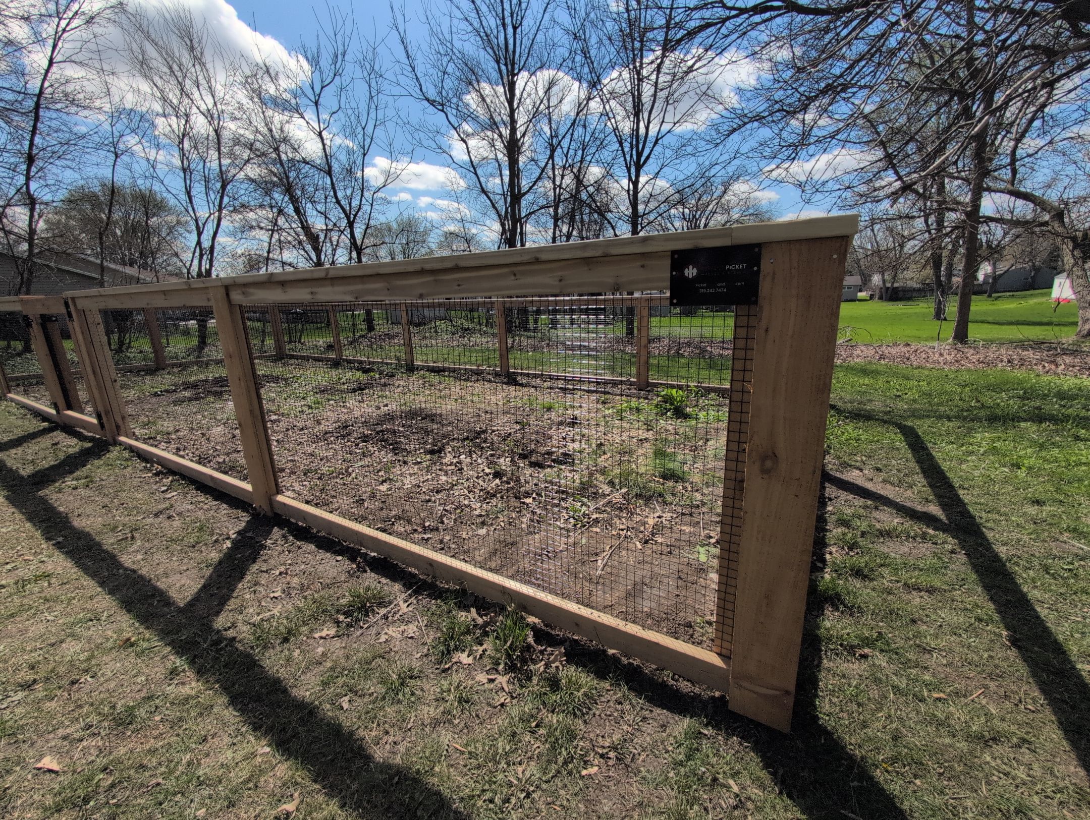 Custom Cedar Wood Garden Fence Installation in Cedar Falls by Perfect Picket Fence and Stain