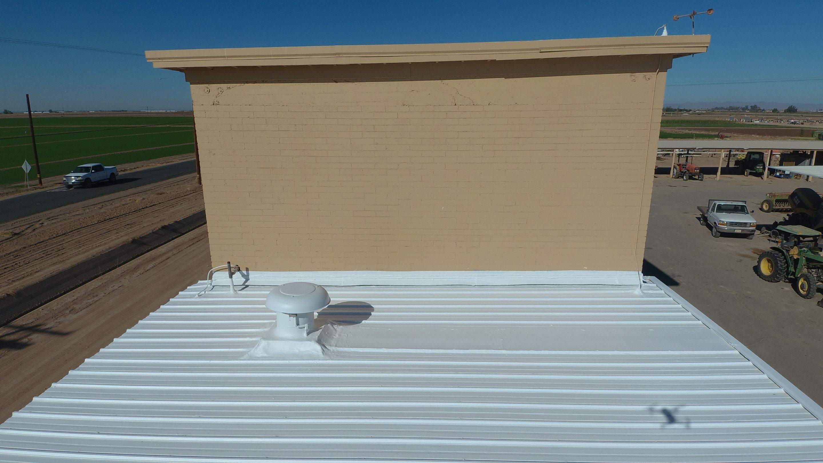 Metal roof restoration on commercial roof using Conklin Benchmark/PUMA XL fabric and coating by Straight Edge Roofing Inc