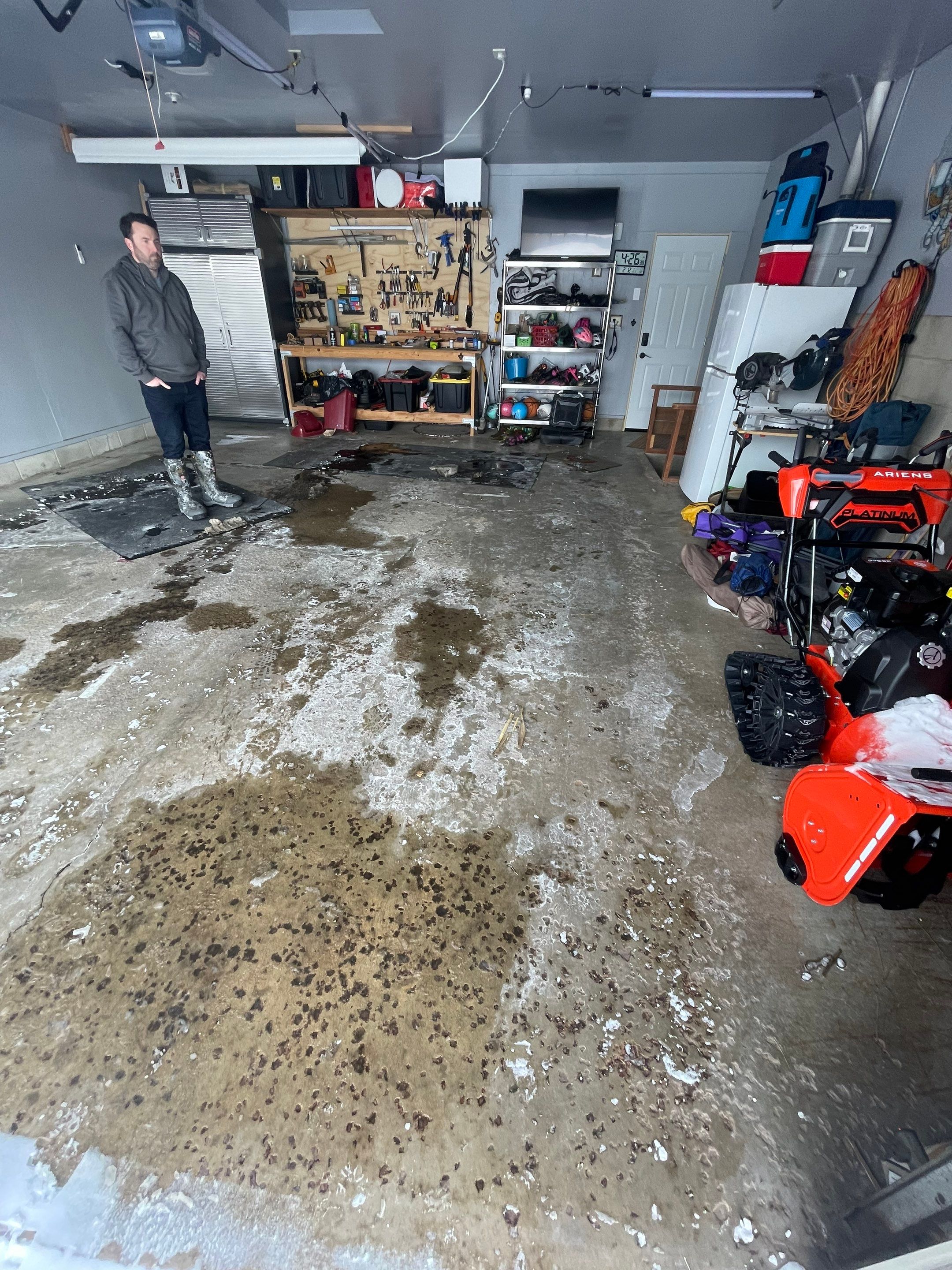 Multi-Colored Speckled Concrete Floor Coating Installation in Sioux Falls by Select Painting, Coatings & Garage Cabinets