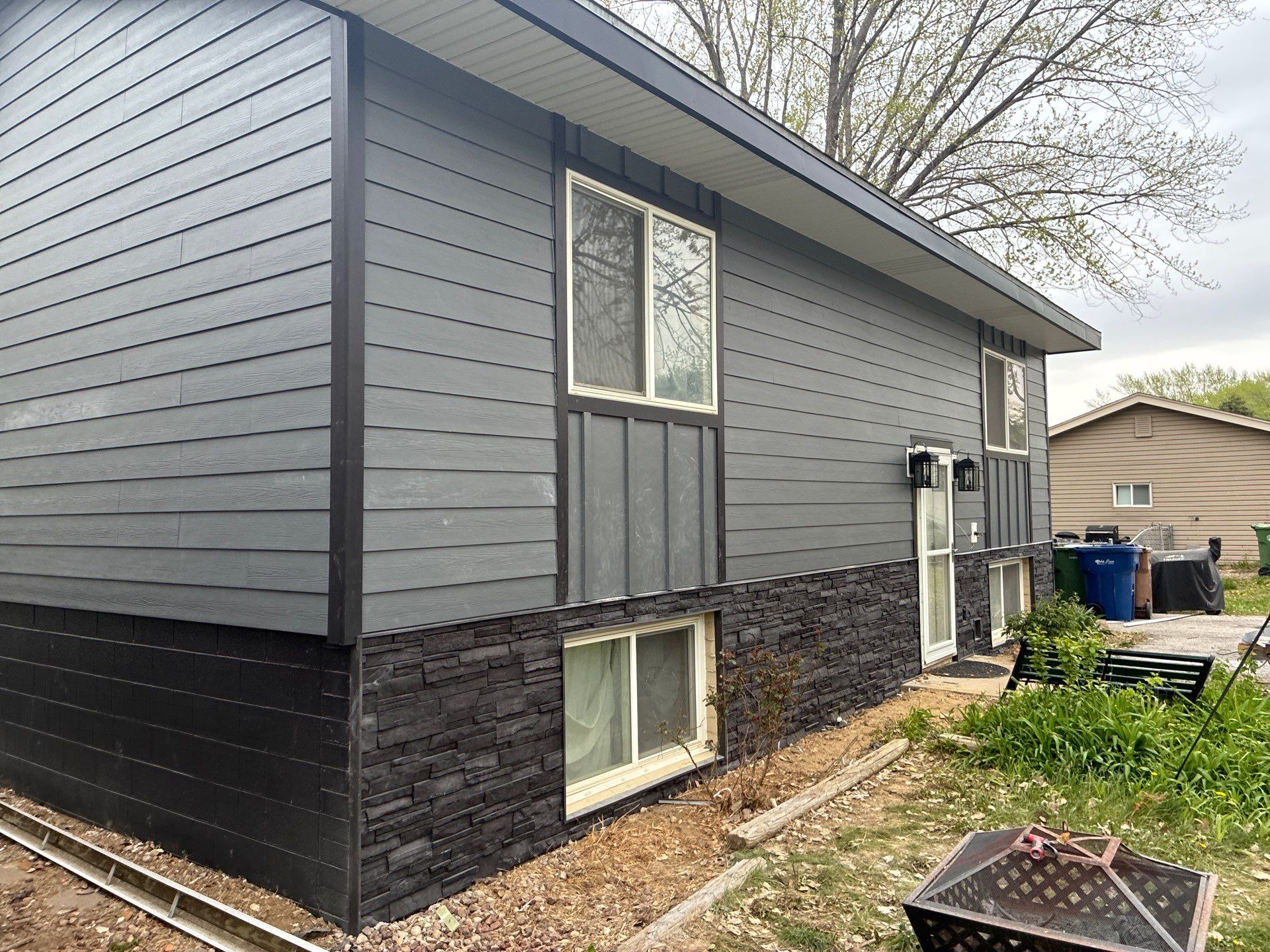 James Hardie Siding and Versetta Stone Exterior Renovation in Bellevue by Carps Complete Exteriors