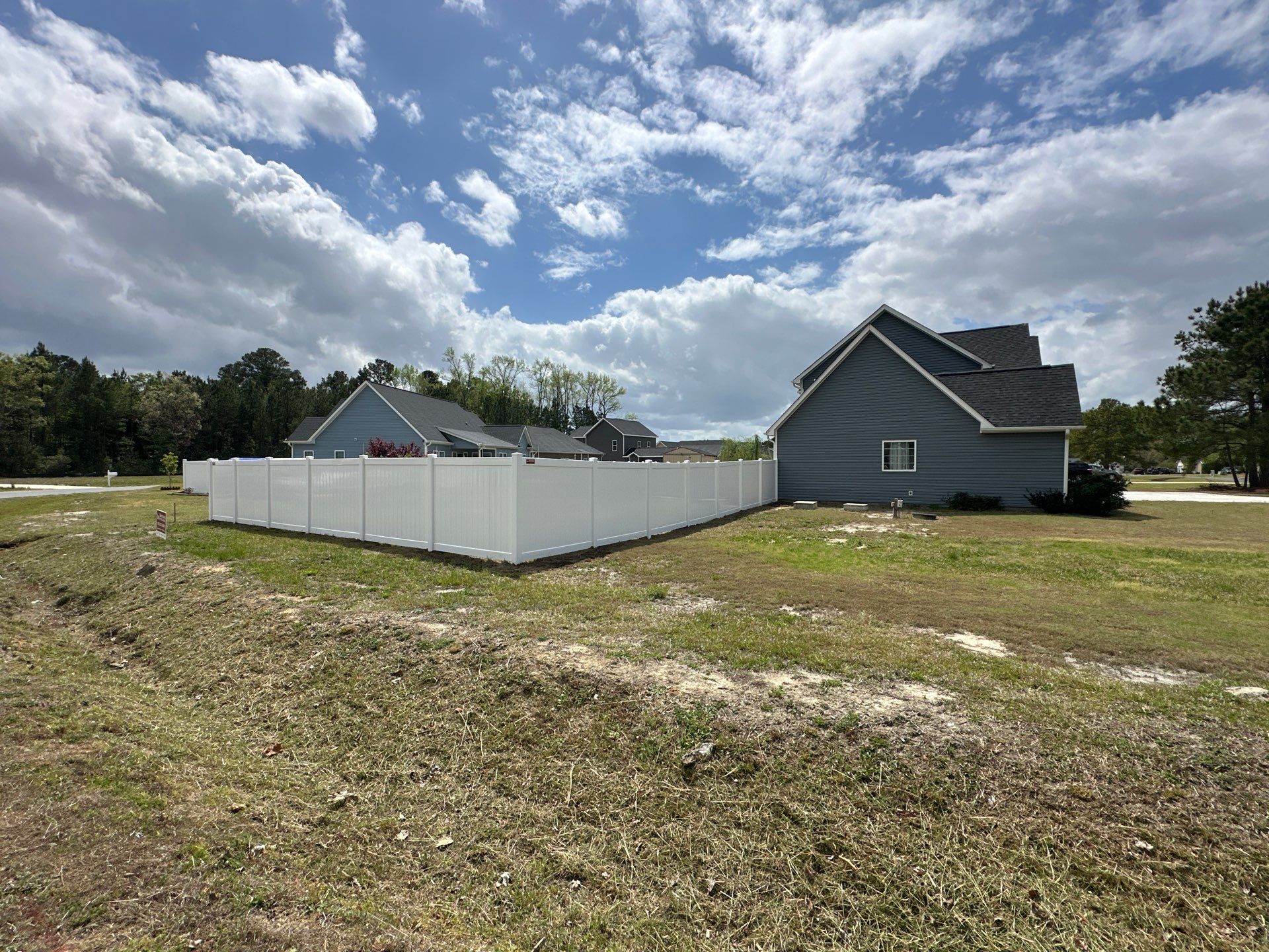 White Vinyl Privacy Fence Installation in Clinton by Superior Fence and Rail