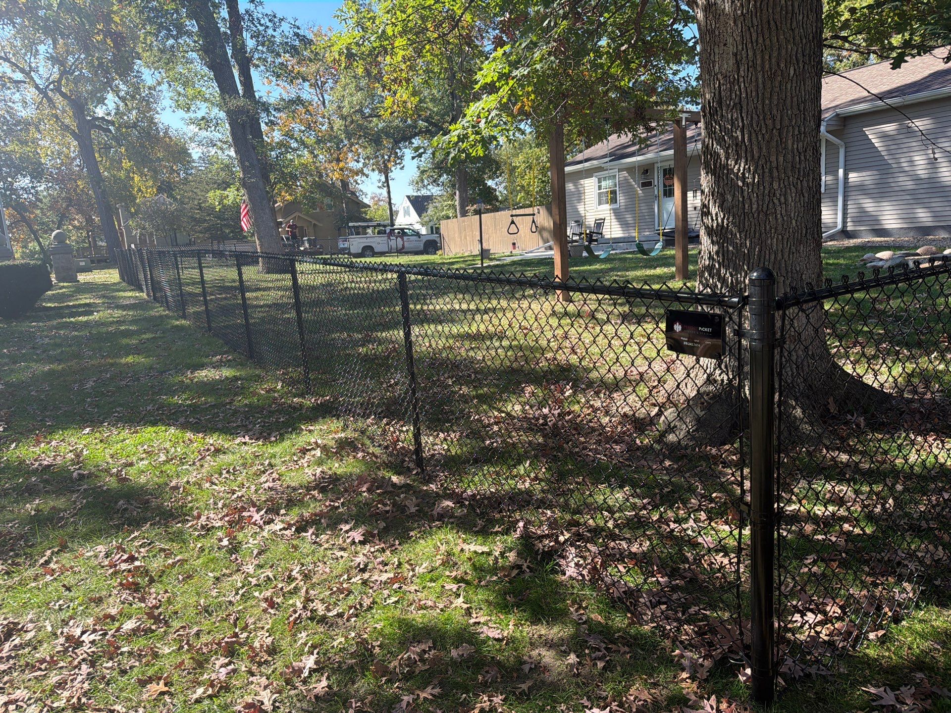 Residential Black Chain Link Fencing in Cedar Falls by Perfect Picket Fence and Stain