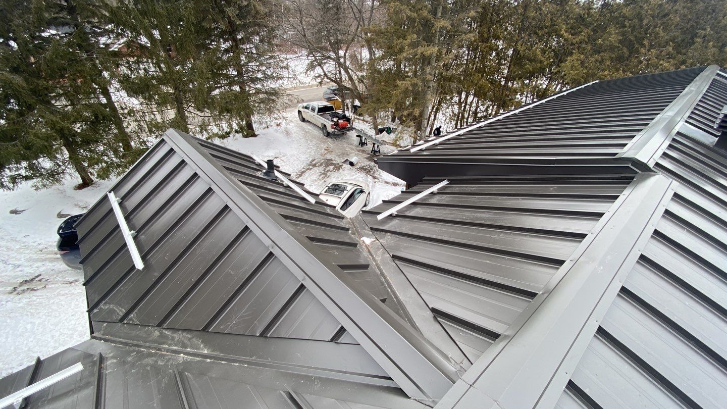 Residential Roofing Installation using 16" Standing Seam Panels by Jay Carter Roofing & Sheet Metal