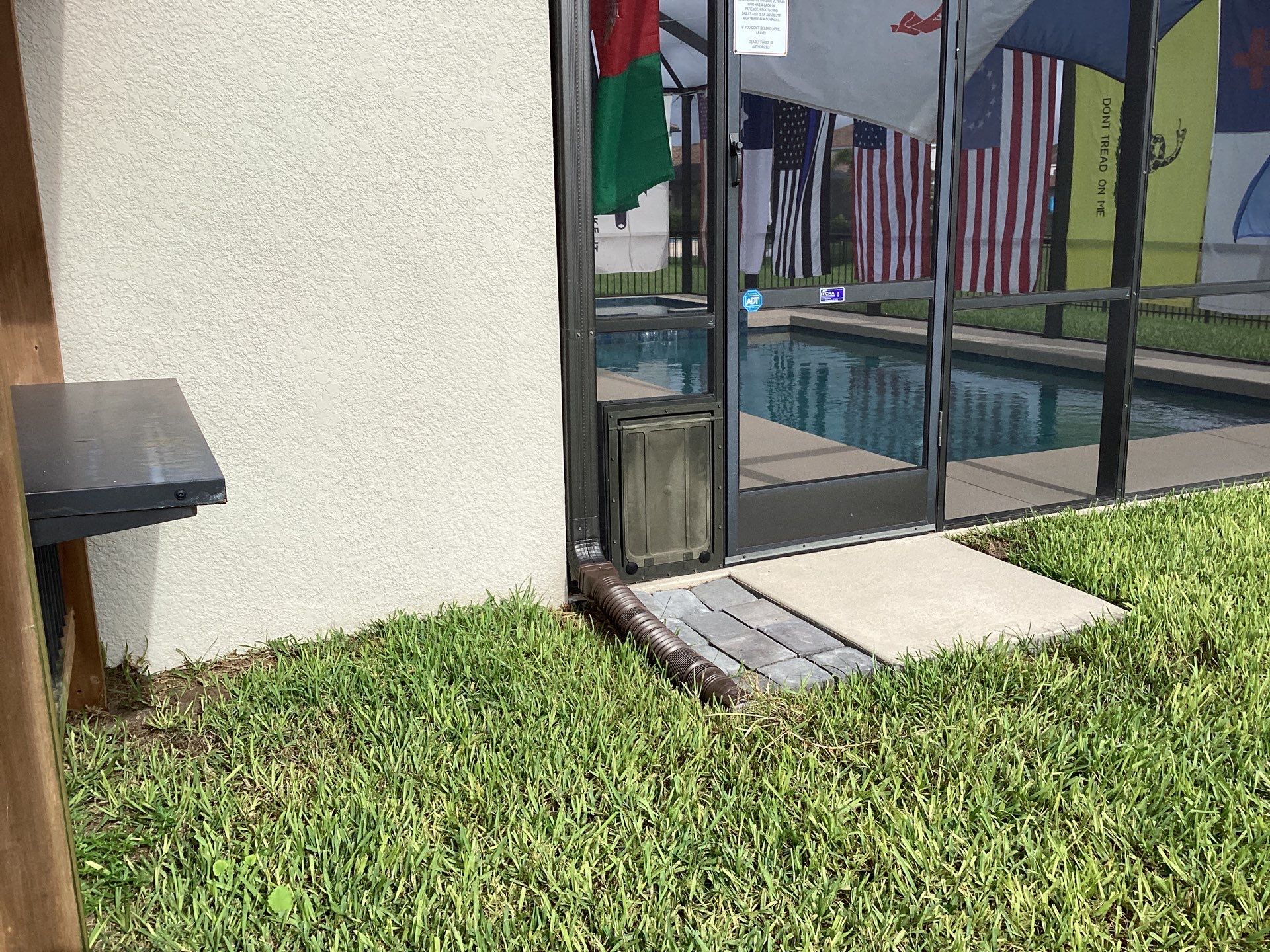 Musket brown seamless gutters with splash guards, new downspouts, and extensions in Bradenton, FL by Gutter Professors