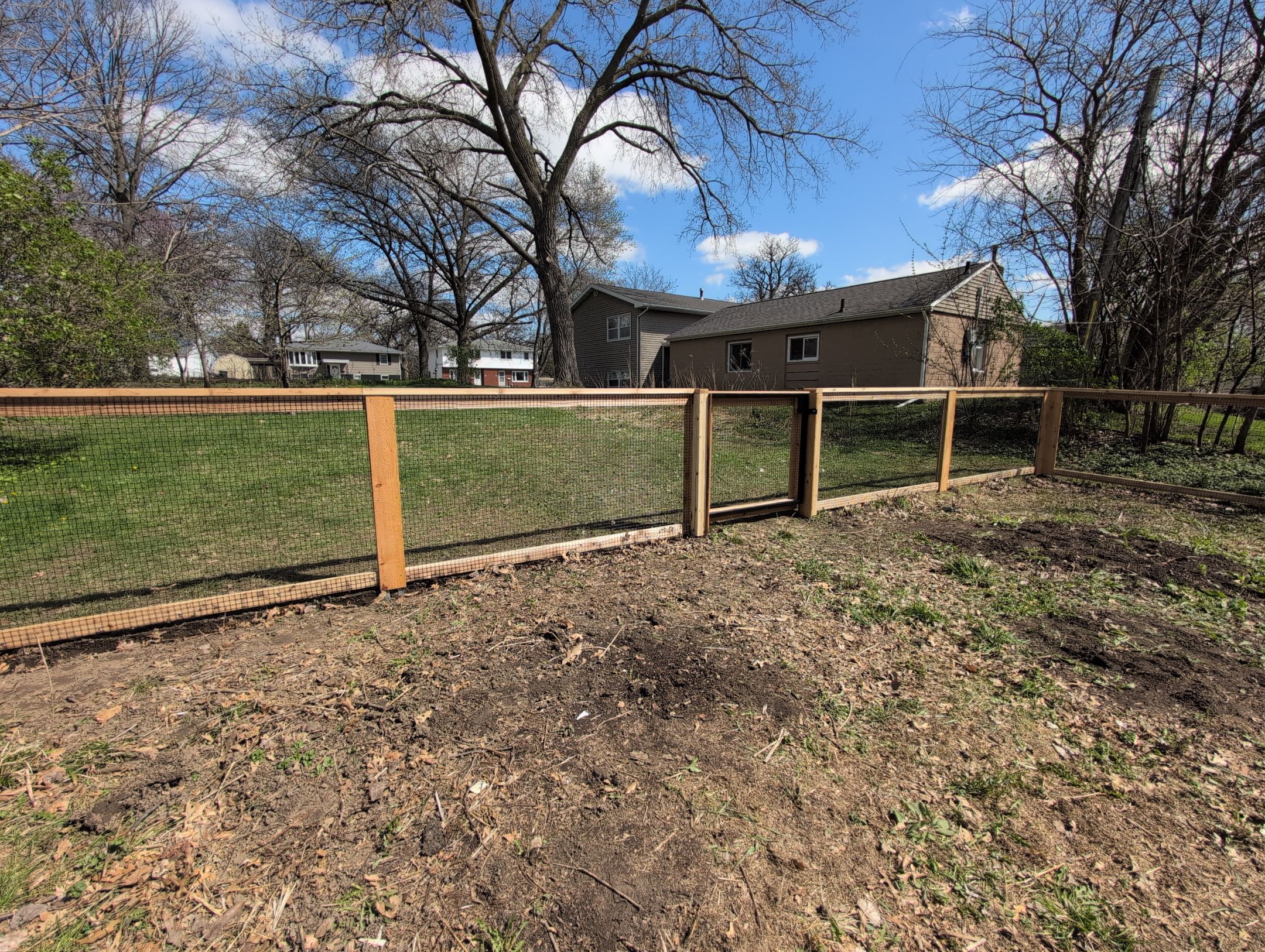 Custom Cedar Wood Garden Fence Installation in Cedar Falls by Perfect Picket Fence and Stain