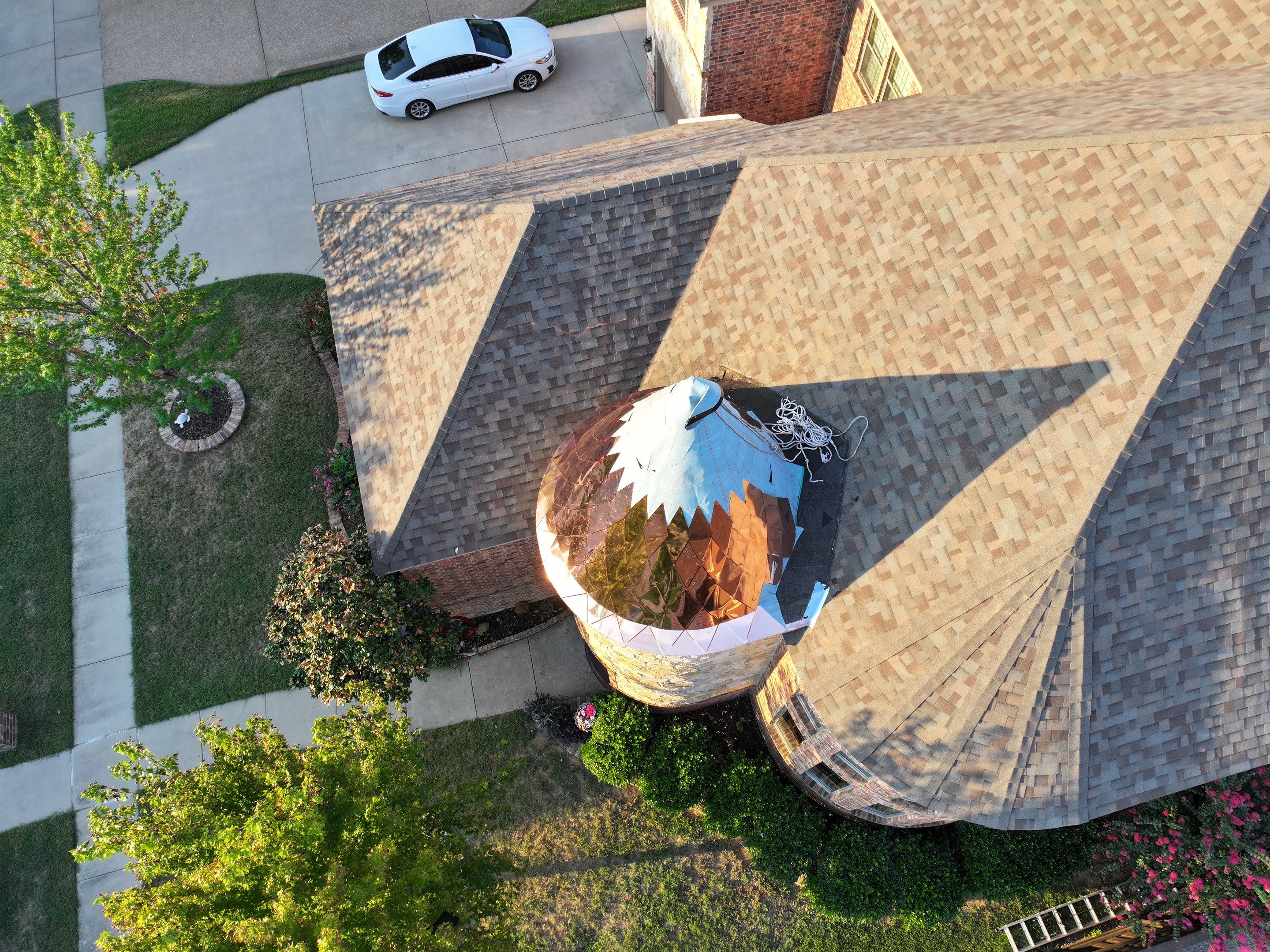 Installing Custom copper turret and Malarkey Vista Class 4 shingles Hail Damage Upgrade by Becker Roofing and Exteriors