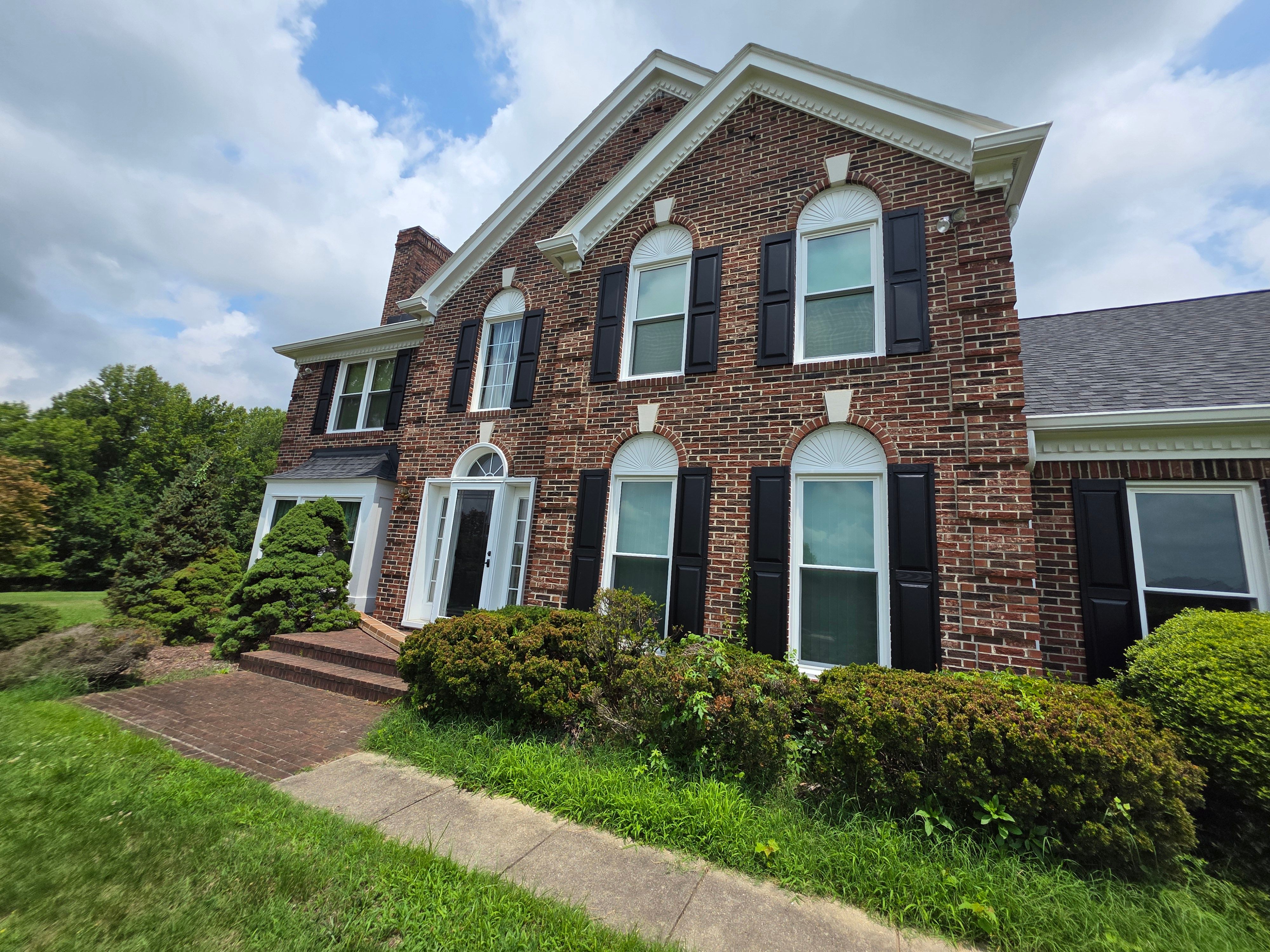 Vinyl Window Replacement for Two-Story Brick Home in Upper Marlboro by Window Depot of Annapolis