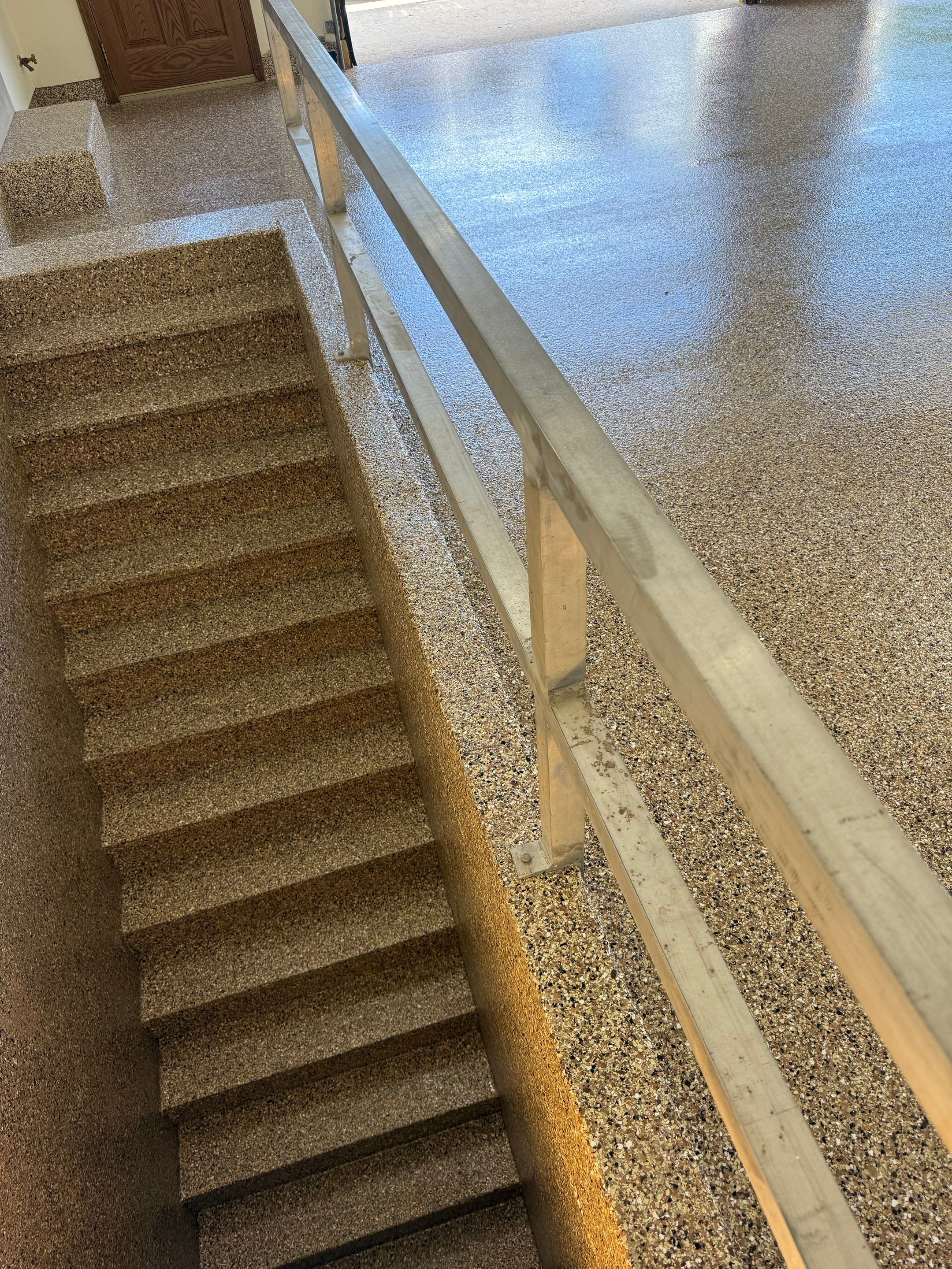 Custom Polyaspartic Garage Floor and Stairwell Coating in Pipestone by Select Painting, Coatings & Garage Cabinets
