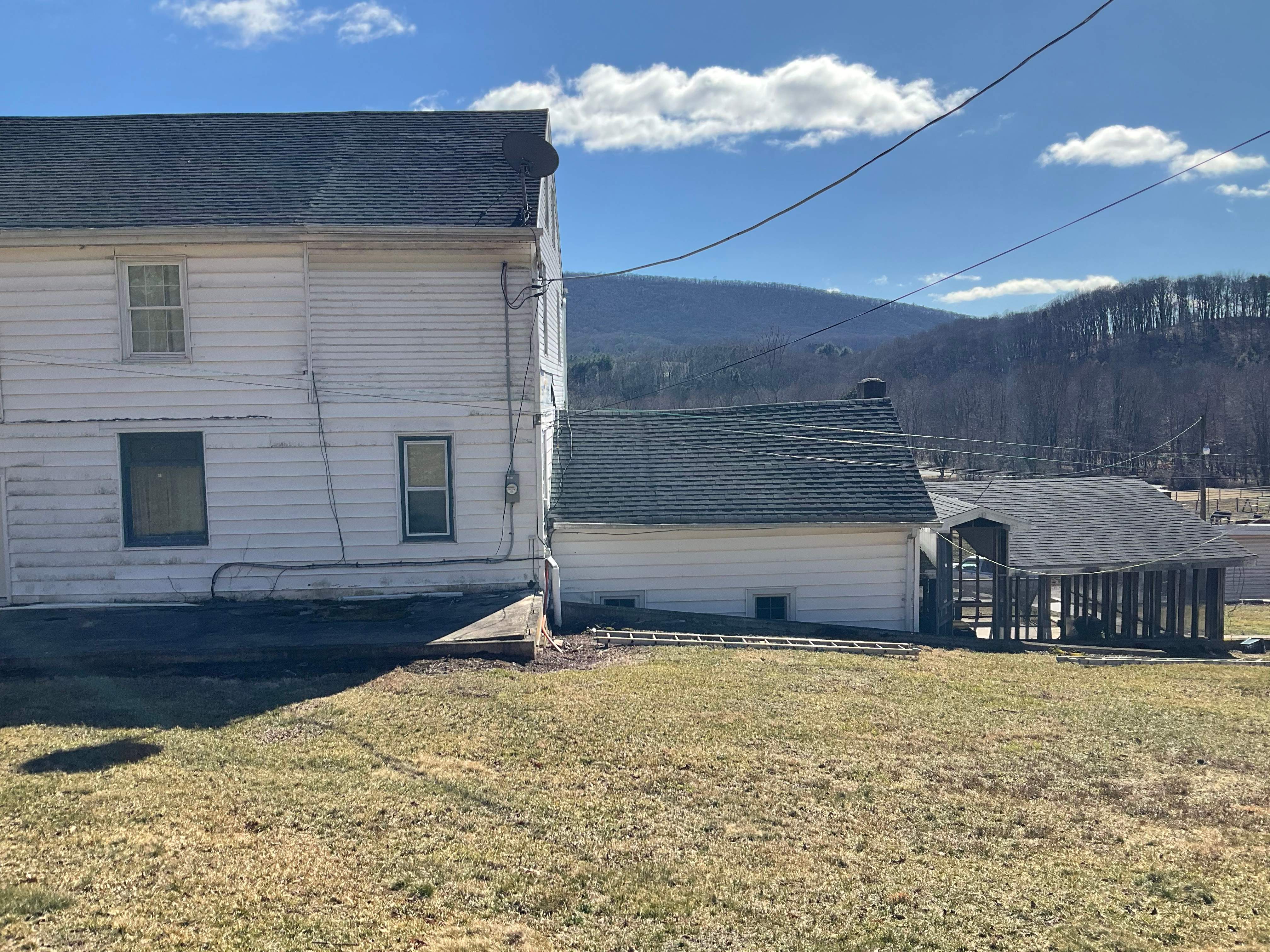 New Metal roof and New siding by Esh Builders
