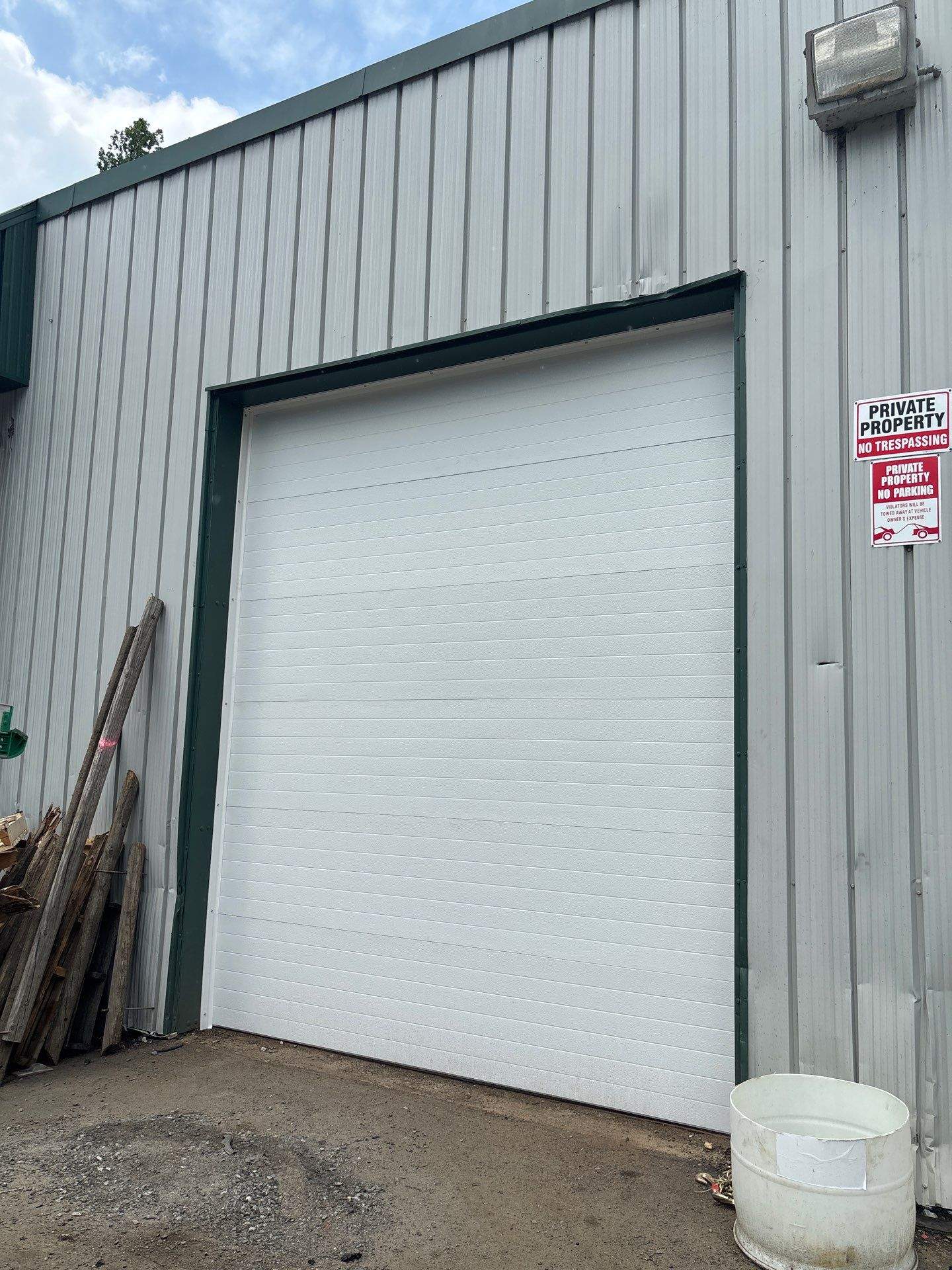 Commercial Door Installation using Clopay Modern Steel Garage Doors by Keene Door