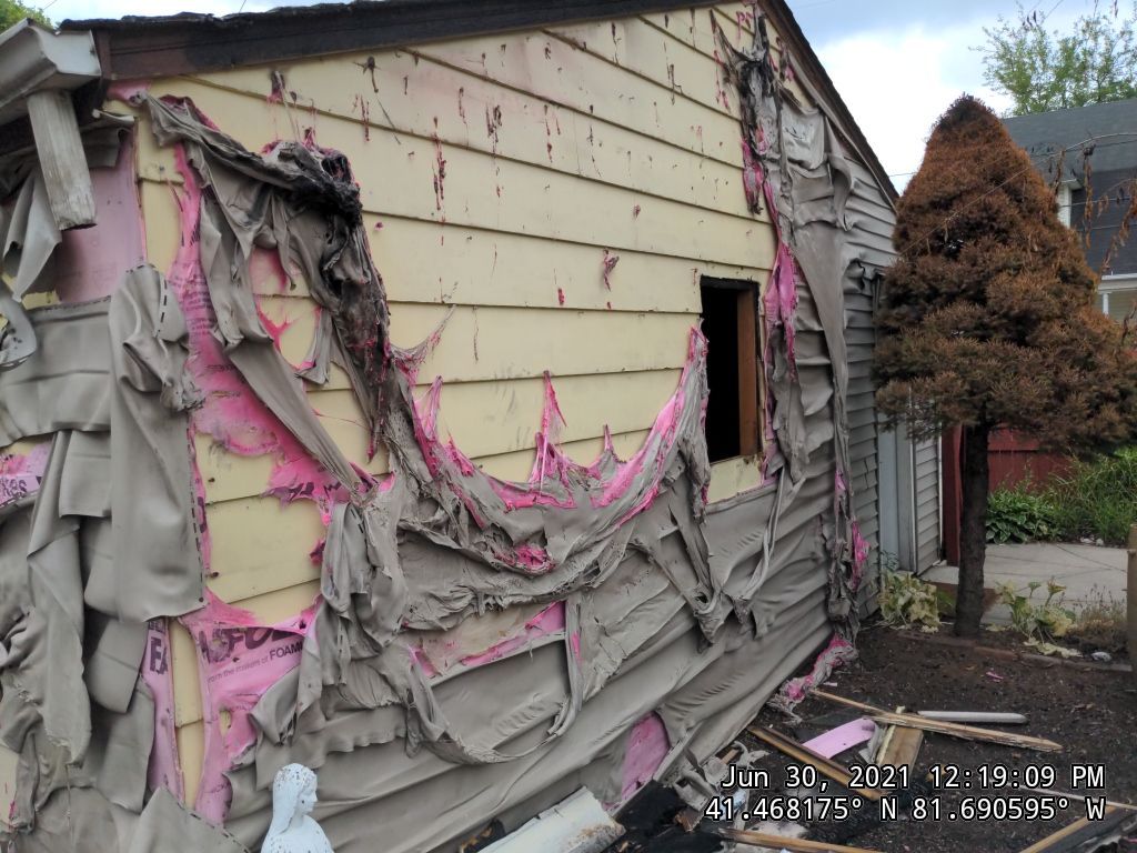 Fire damaged home in Tremont by Absolute Roofing and Construction