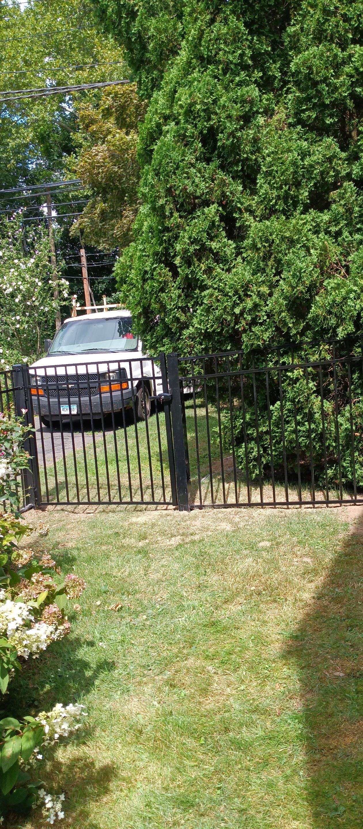 Black Aluminum Fence with matching Gate by DiGiorgi Roofing and Siding Inc