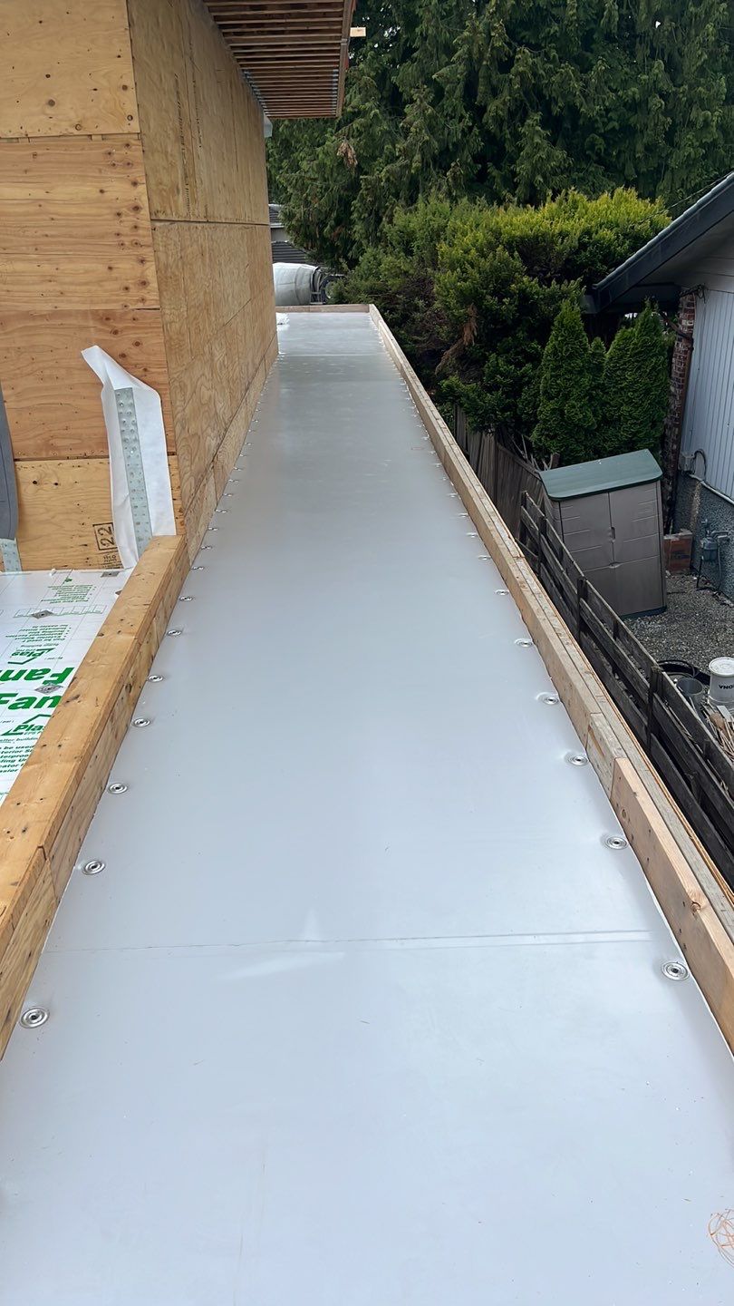 Residential Roofing Installation using Durolast roofing membrane by Top Notch Roofing Inc