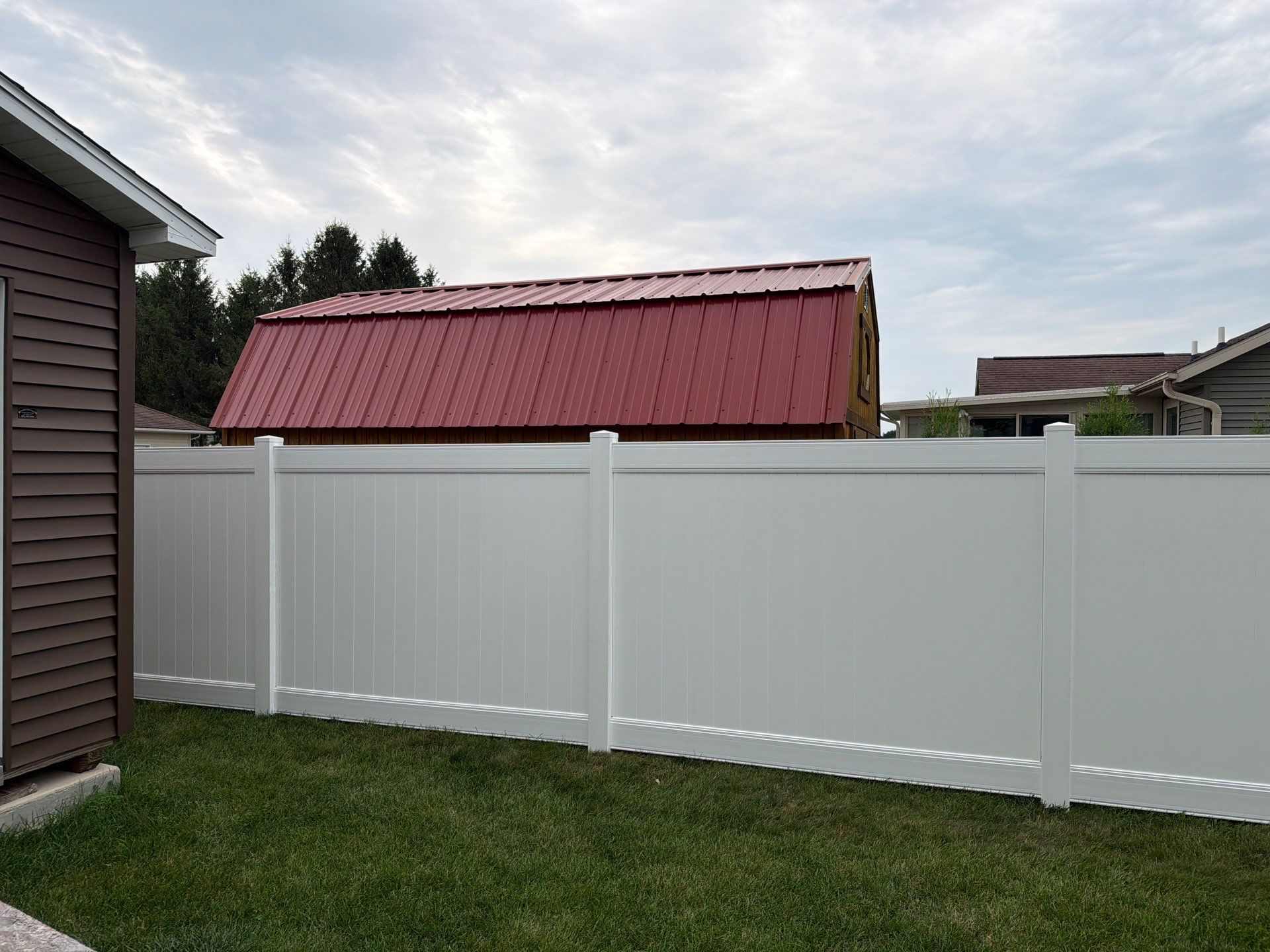 White Vinyl Privacy Fence and Double Gate Installation in Jesup by Perfect Picket Fence and Stain