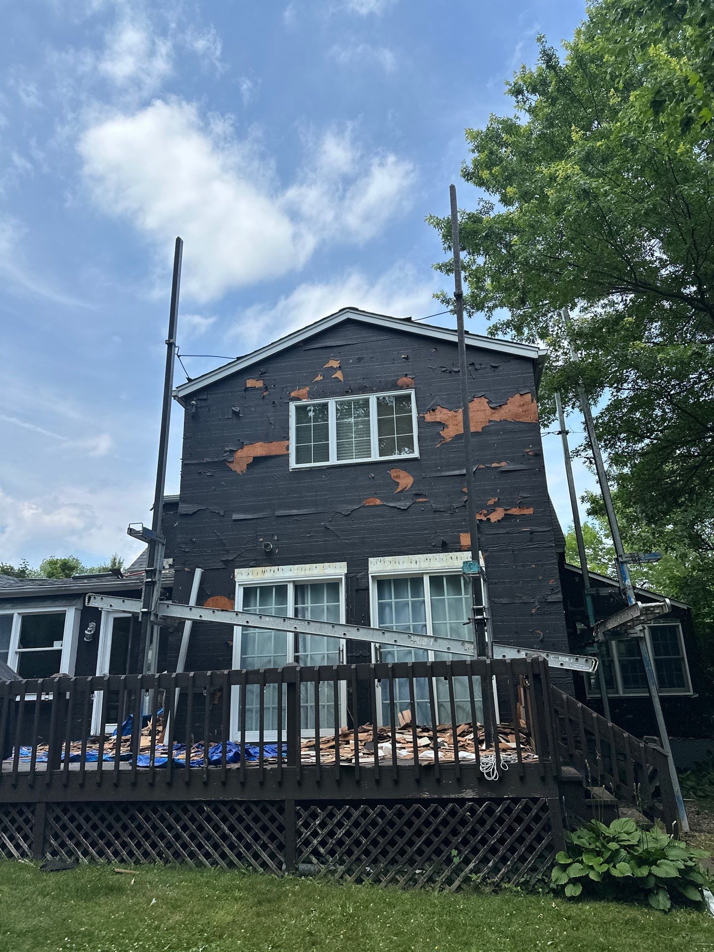 Complete Exterior Estate gray with Pacific Blue Siding by A Plus Exterior