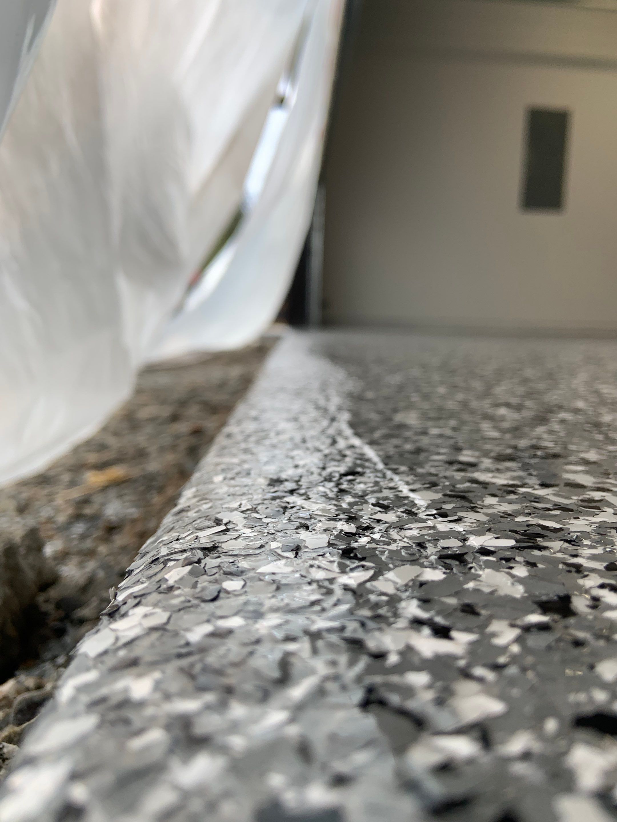 Garage Transformation using Smoke by Croc Coatings, LLC