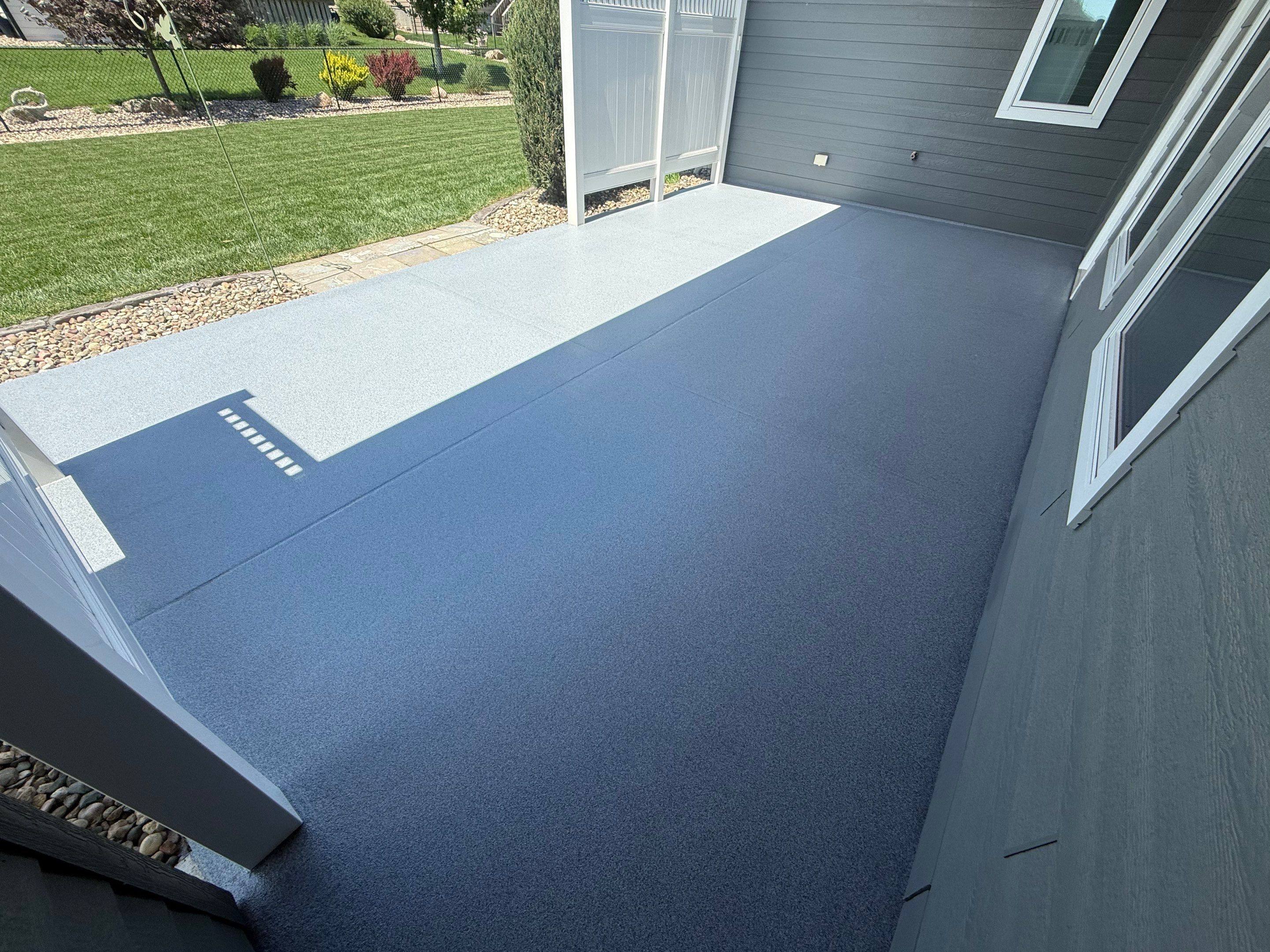 Polyurea Patio Floor Coating in Starry Evening for Sioux Falls Home by Select Painting, Coatings & Garage Cabinets