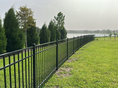 Aluminum Fence Installation using Black 3 Rail Aluminum Fence