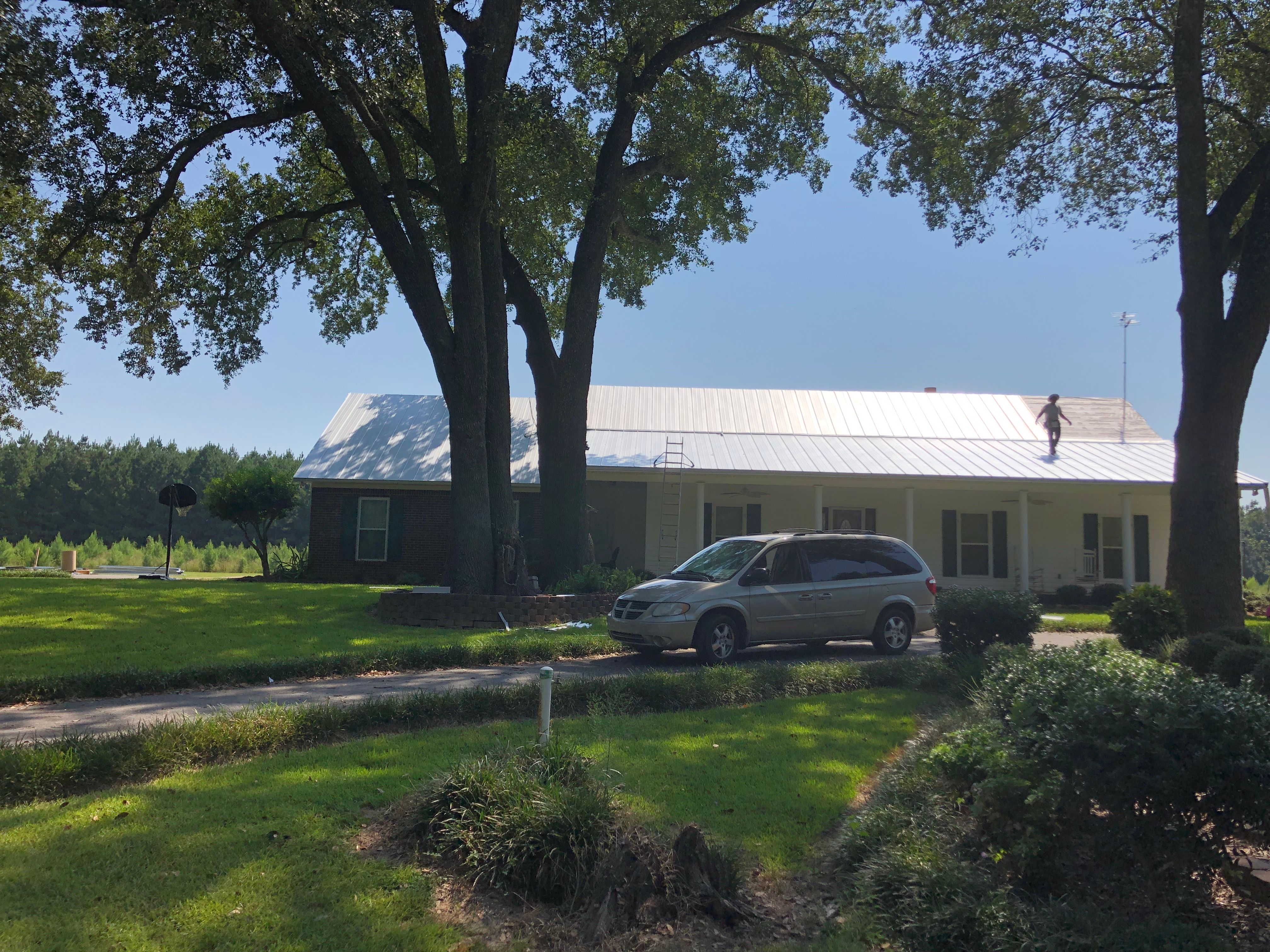 Residential Roofing Installation using Metal roofing by American Roofing & Construction LLC