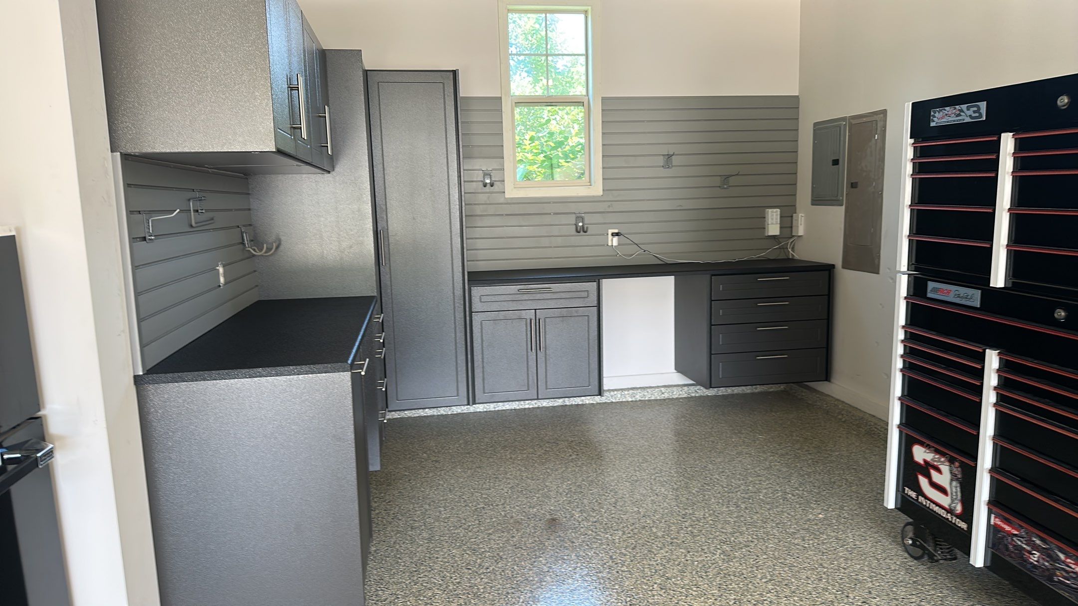 Lori H. upgrade her garage with cabinets and overhead racks by Banner Garage