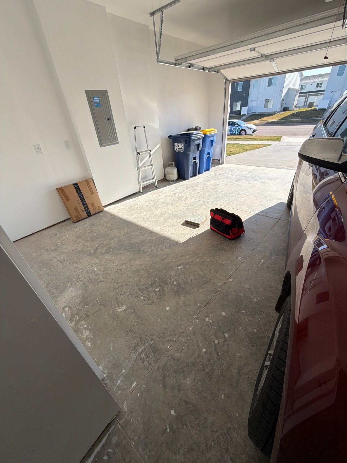 Sioux Falls Garage Floor Transformation with Cabin Fever Decorative Chips by Select Painting, Coatings & Garage Cabinets