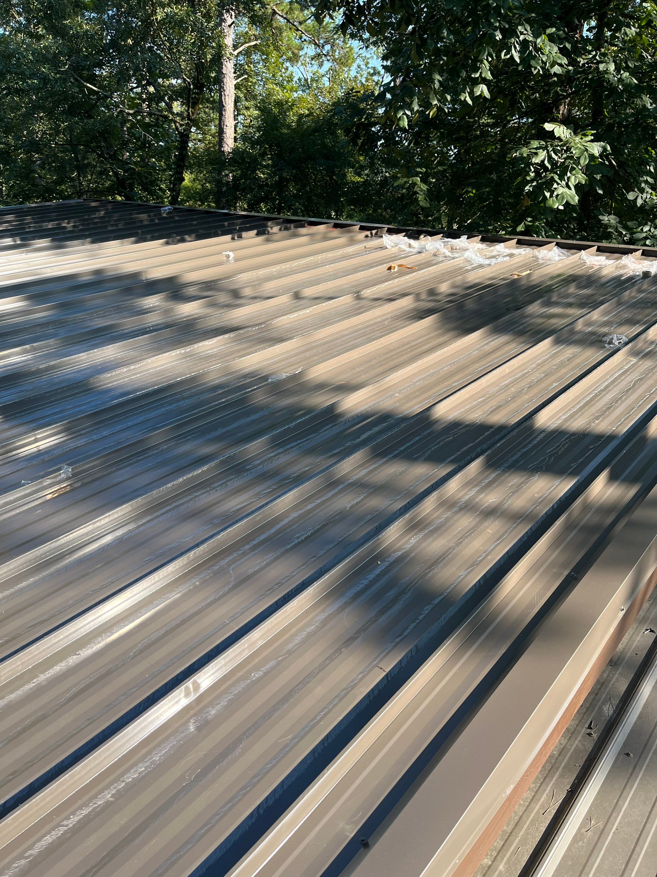 Standing Seam Metal Roof and Gutter Installation in Hot Springs by Temple Roofing and Exteriors