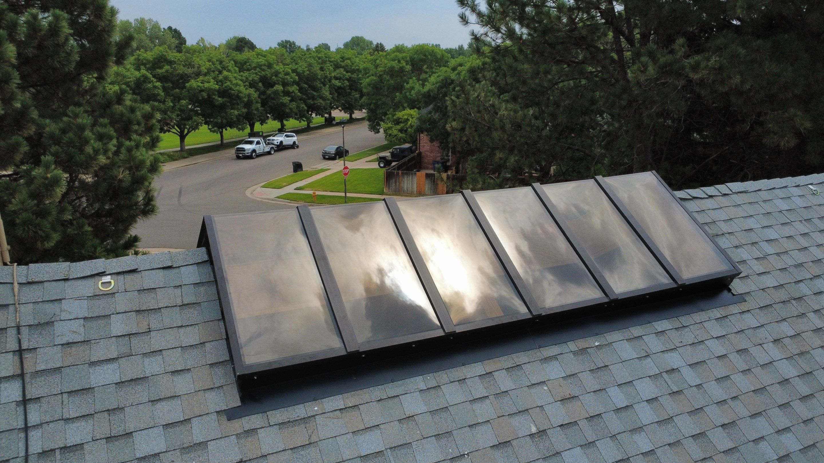 Asphalt Shingle and Skylight Replacement Project in Denver, CO by Blue Peaks Roofing LLC 