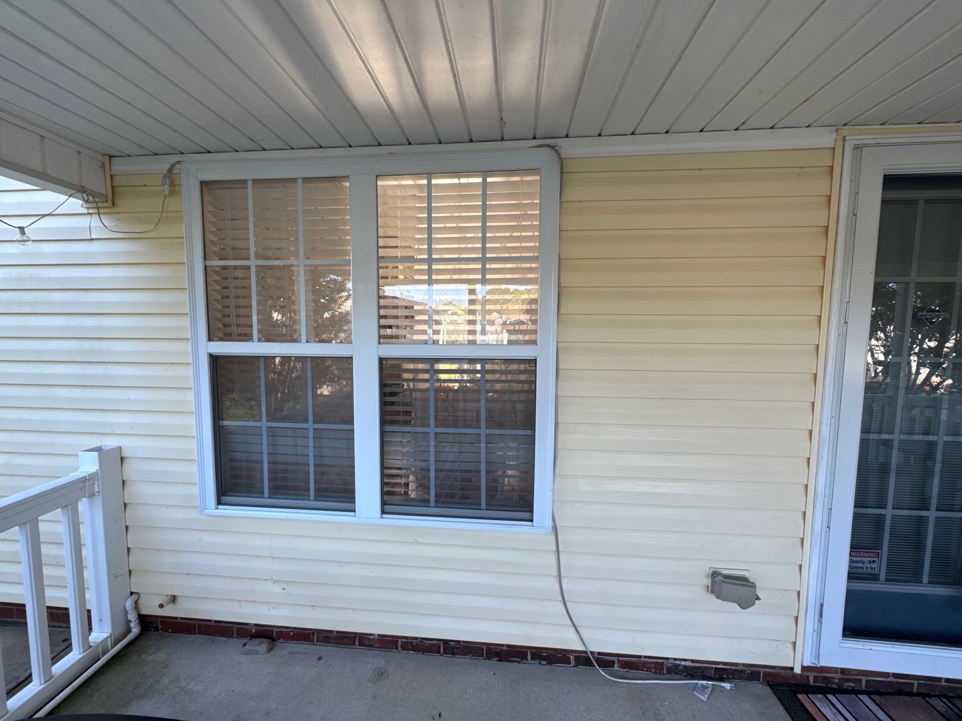 the service being done is cleaning the exterior siding and windows enhancing the overall appearance of the house