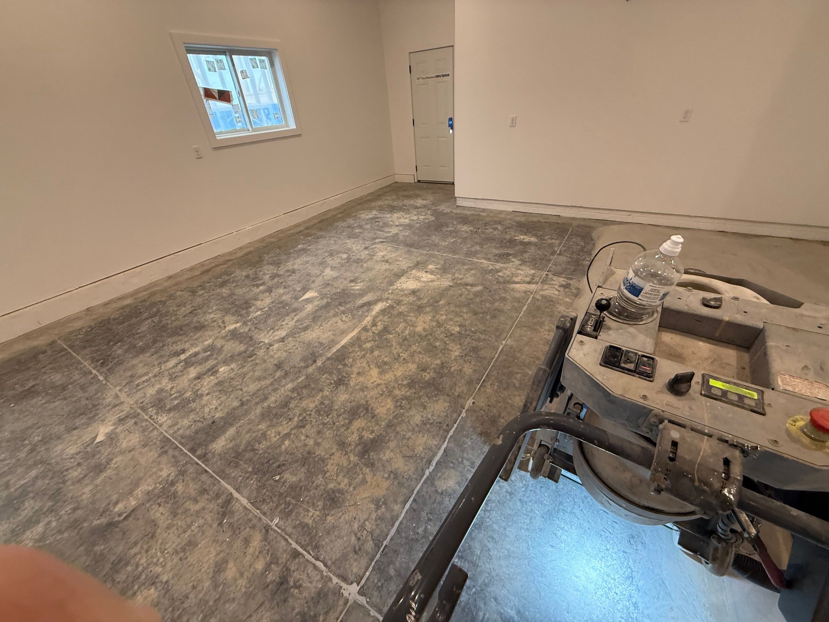 Multi-Car Garage Epoxy Floor Coating and Concrete Finishing in Sioux Falls by Select Painting, Coatings & Garage Cabinets