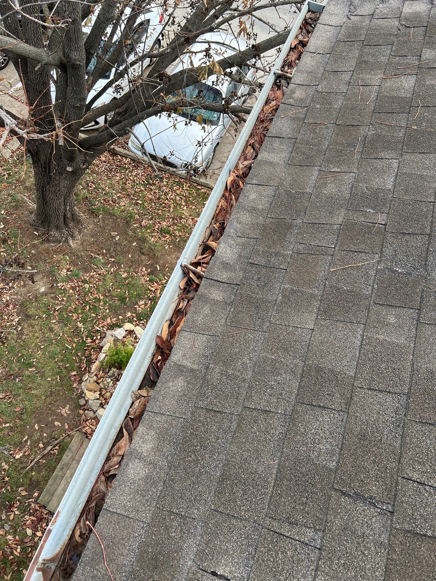 Commercial gutter cleaning Topeka, KS before photo with filled gutters