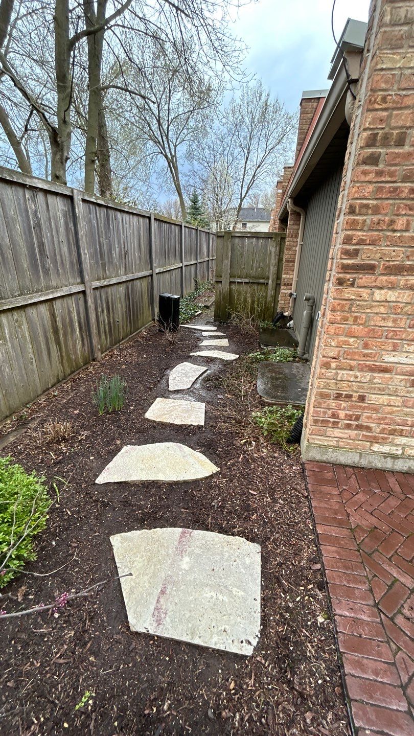 Flagstone stepper cleaning by Northern Power Washing LLC.