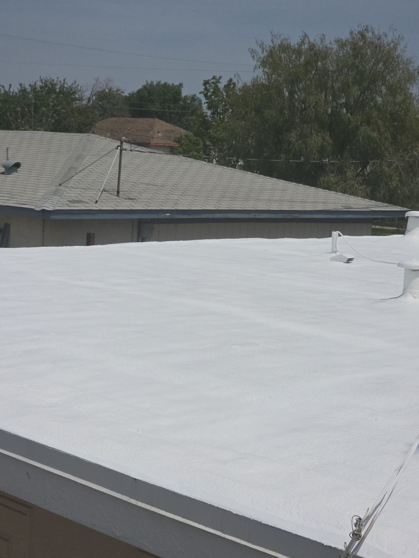 Foam Refurbish using Conklin Benchmark/PUMA XL coatings and spray foam by Straight Edge Roofing Inc