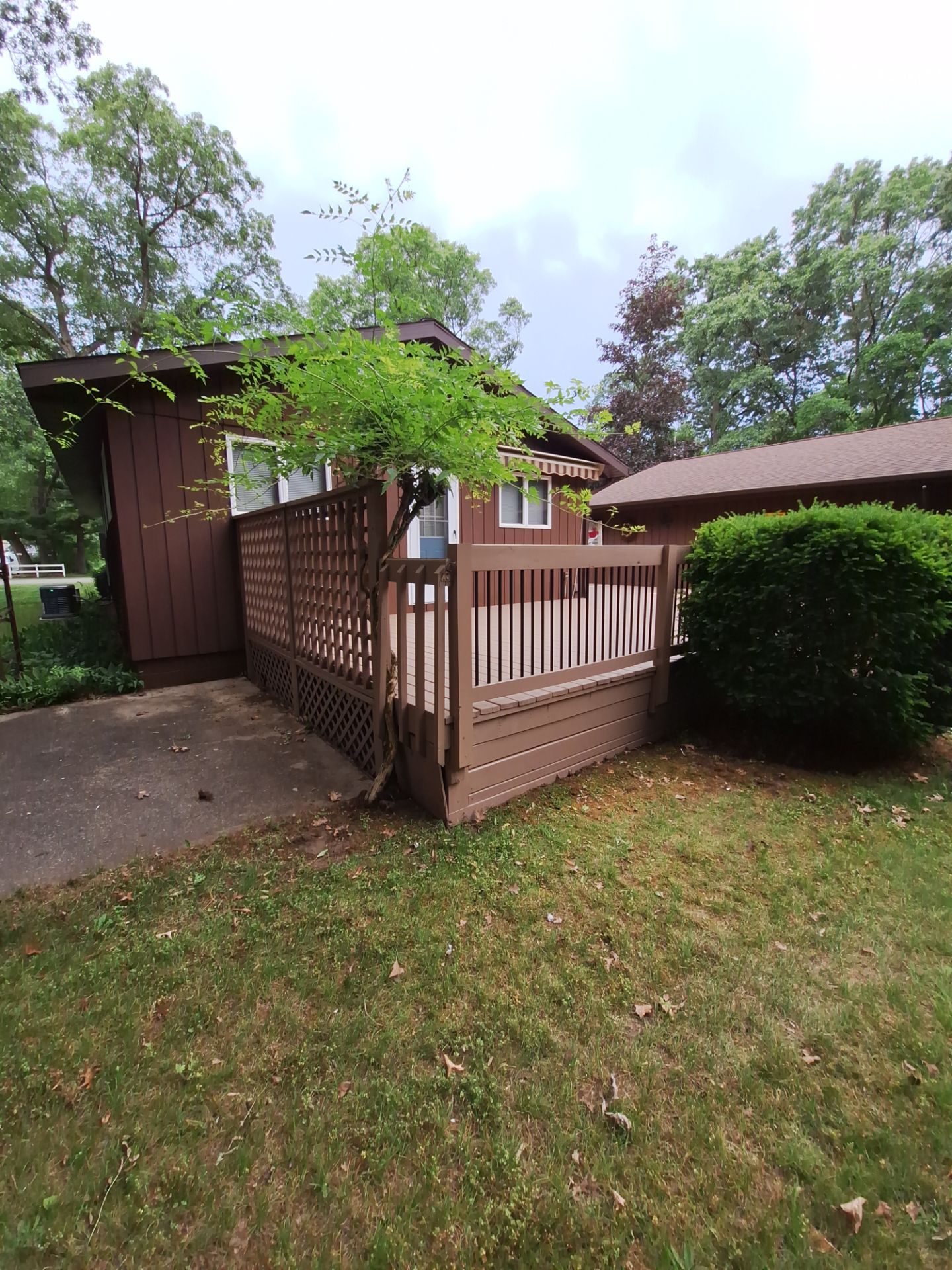 Muskegon Deck Restoration with Pressure Treated Railings and Wood Staining by Gordon Painting