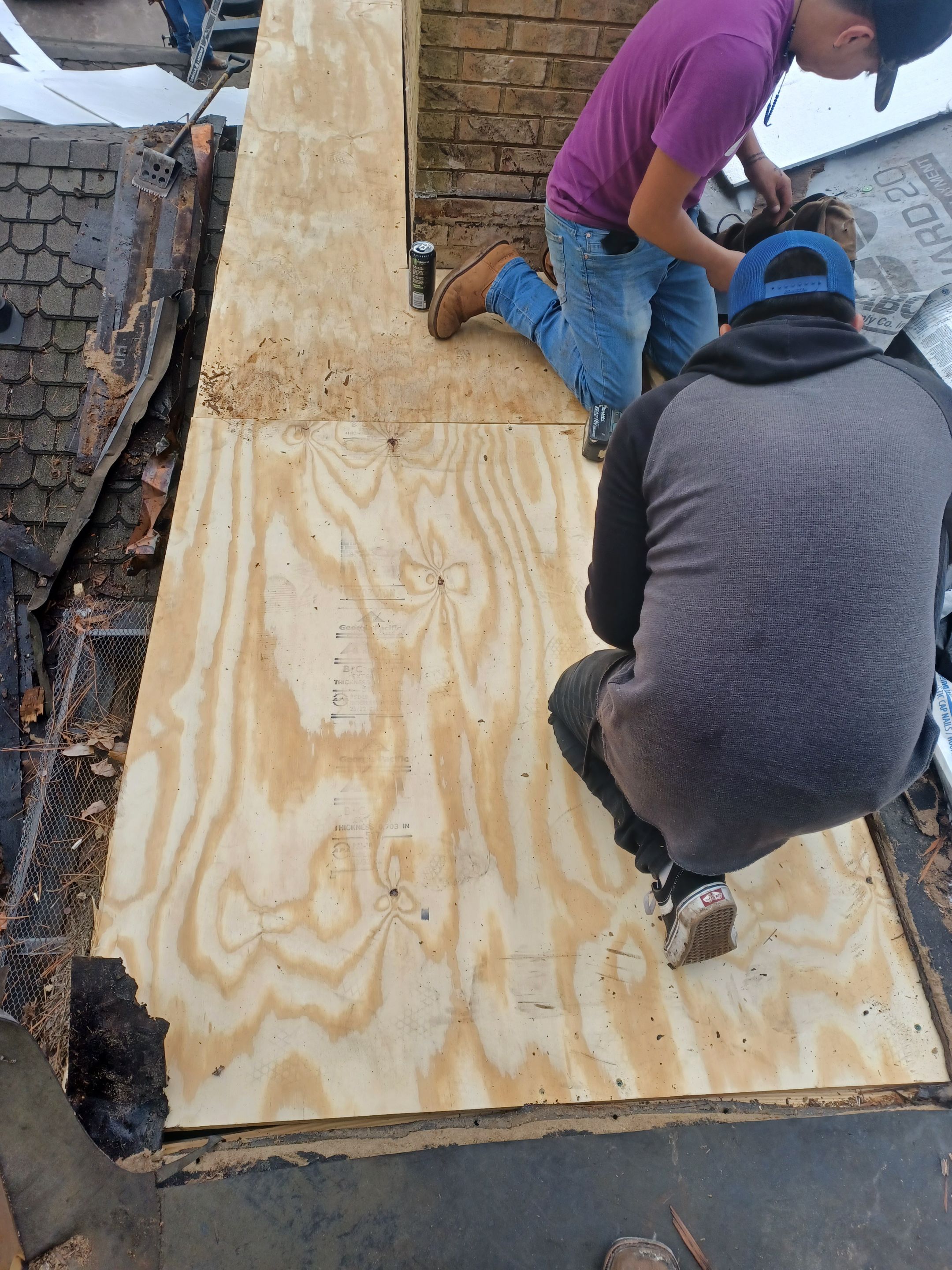 Residential Roofing Installation using PVC membrane and 24 gauge Standing Seam Metal by Hostetler Roofing