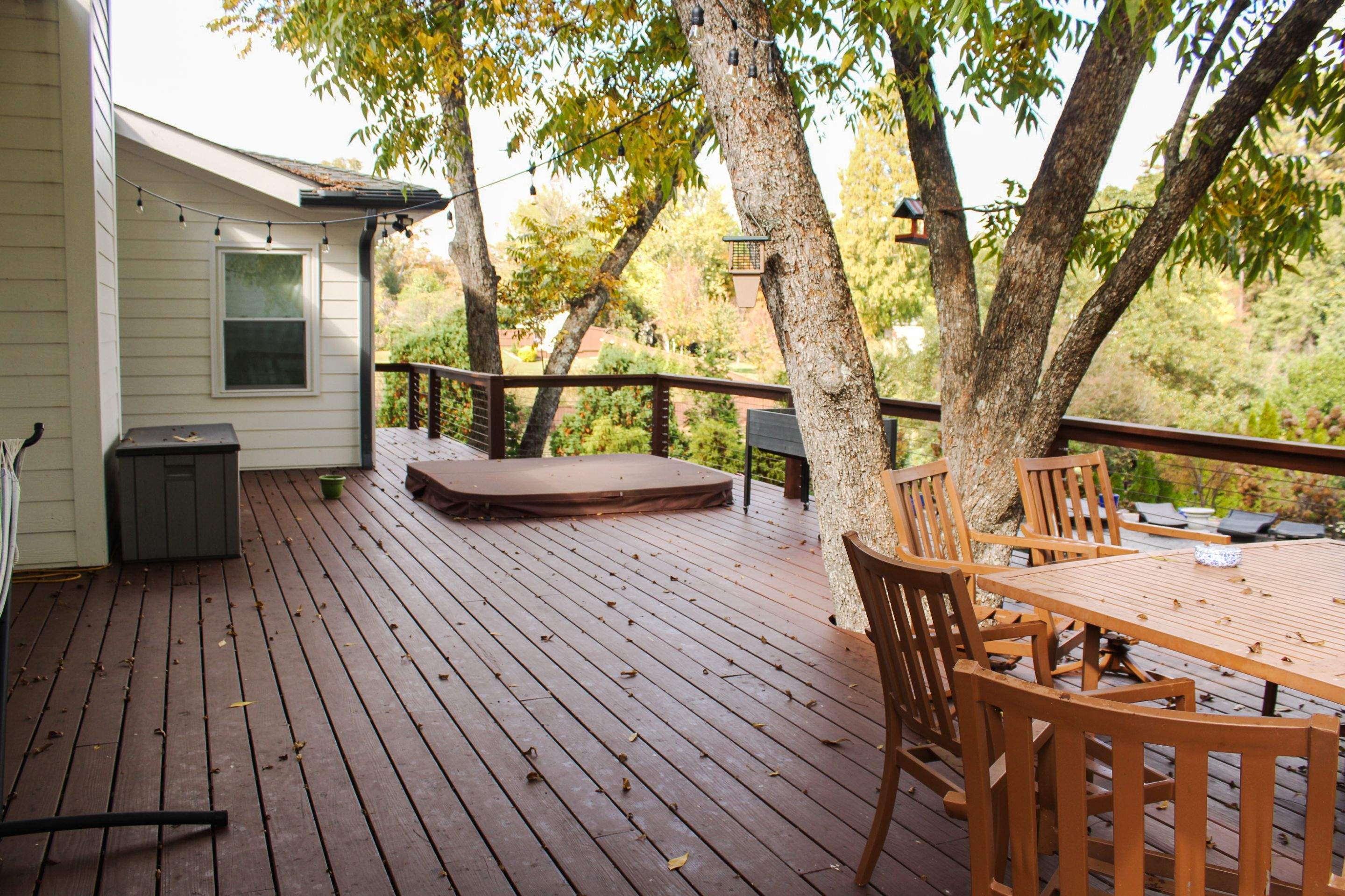 Deck Resurface with Glass Paneling and Deckorators Voyage Series Products by Nelson Exteriors 