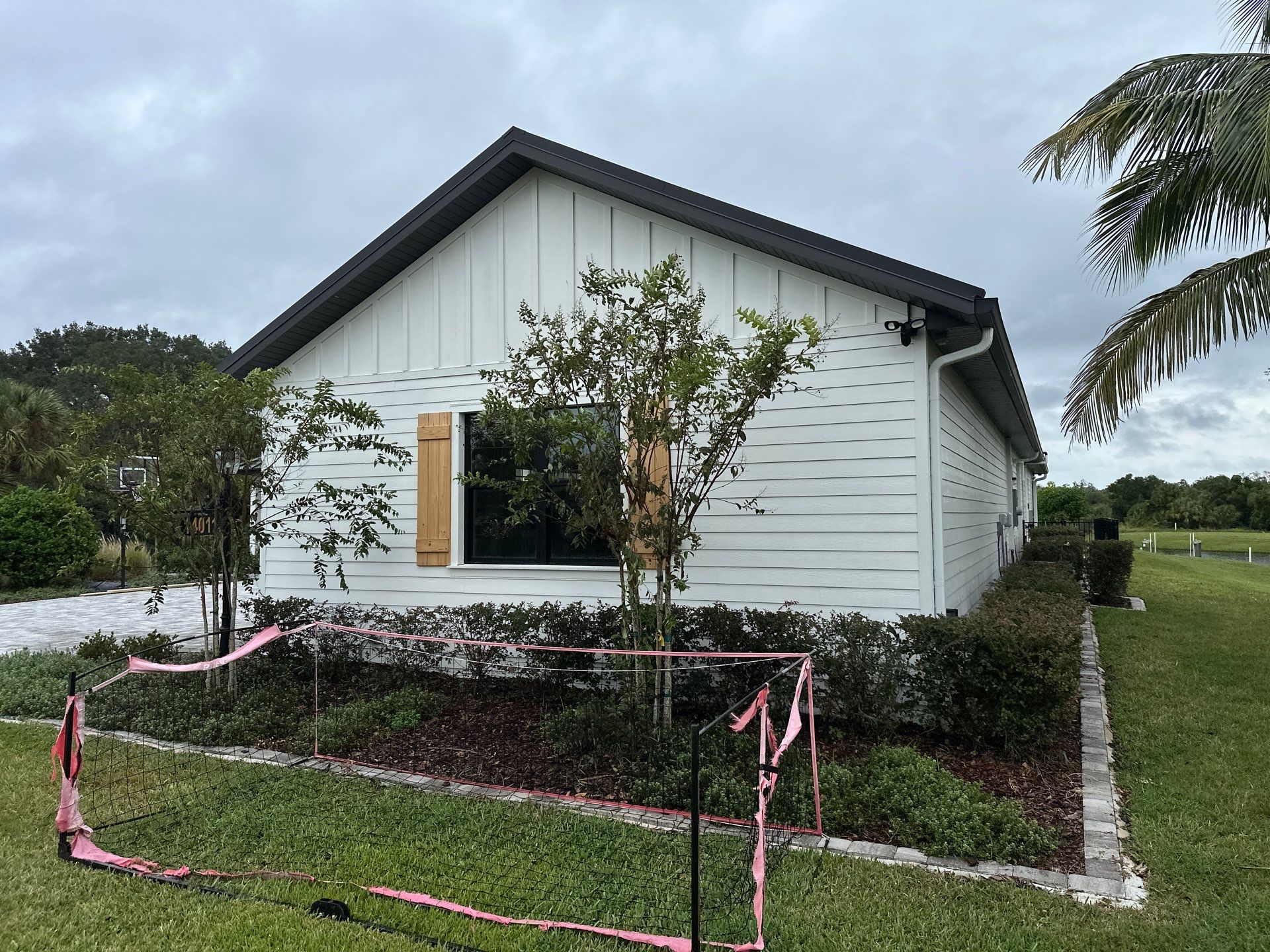 Complete Two-Story House Wash and Driveway Cleaning in Winding River Community, Bradenton, FL by Sunshine AquaWash
