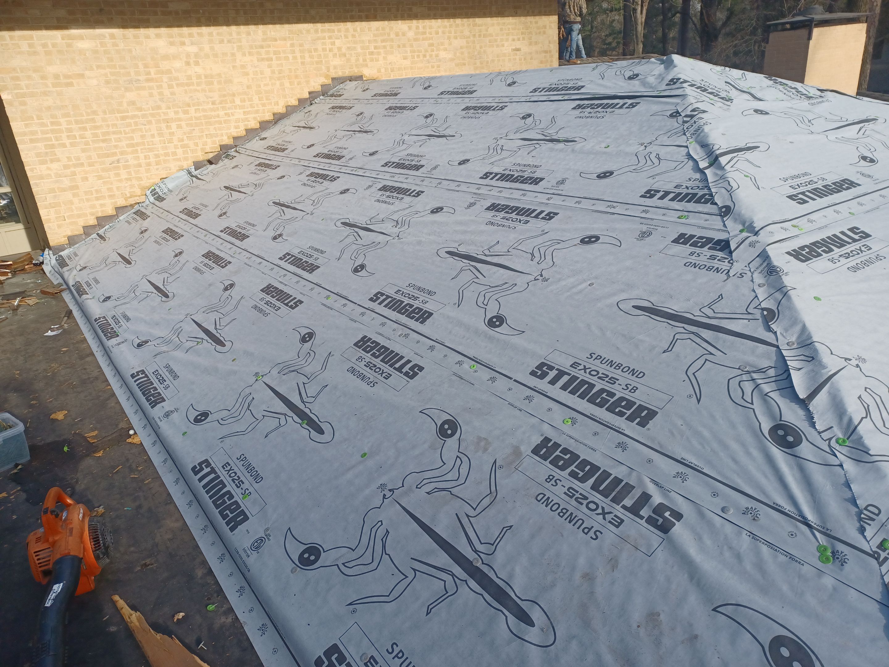 Residential Roofing Installation using PVC membrane and 24 gauge Standing Seam Metal by Hostetler Roofing