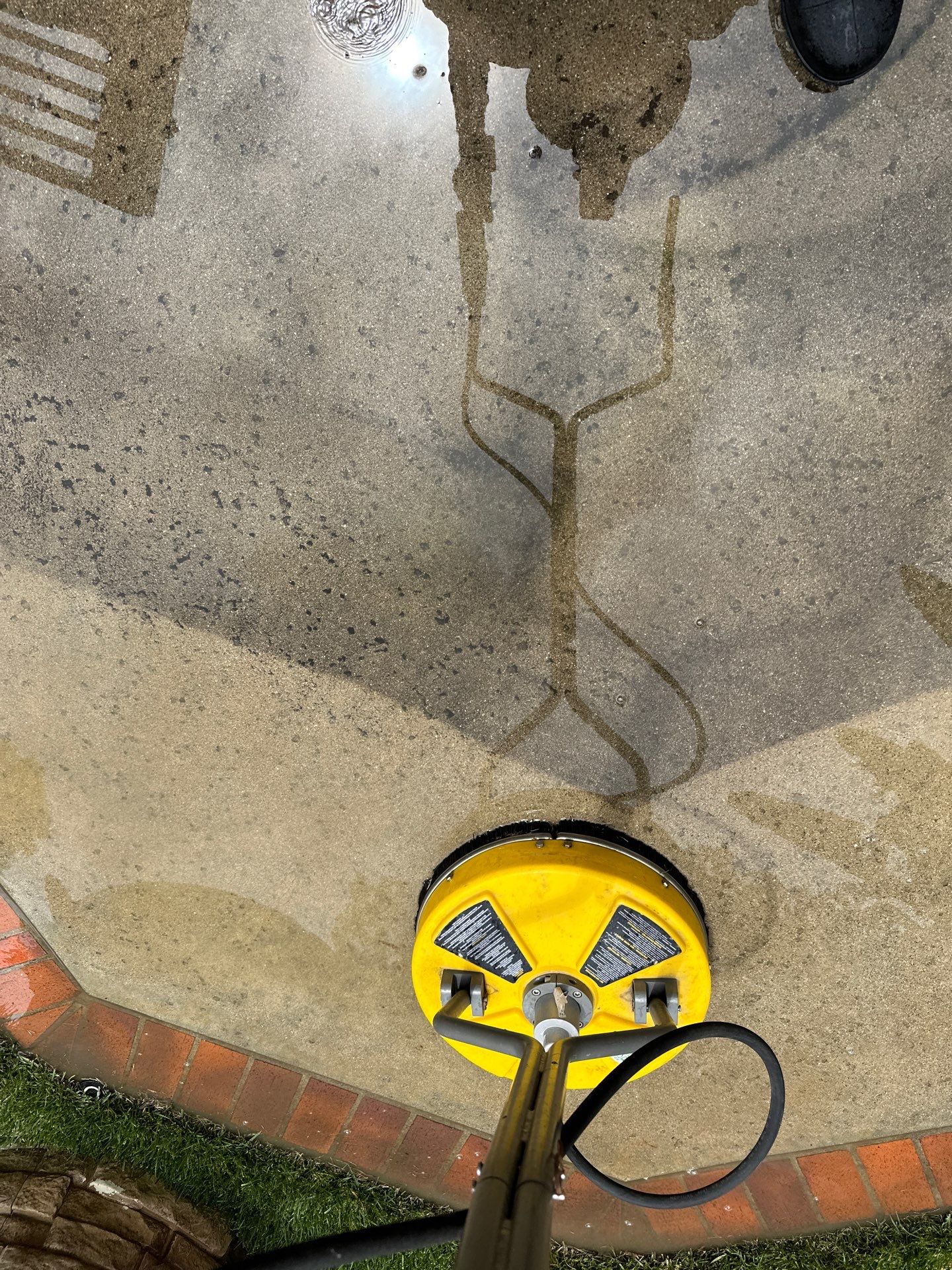 Surface cleaning pressure washing in Orange County on patio, walkways, and driveway by Property Cleaning Experts, LLC