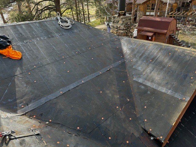 Residential Roofing Installation using Standing Seam Metal by Blue Peaks Roofing LLC 