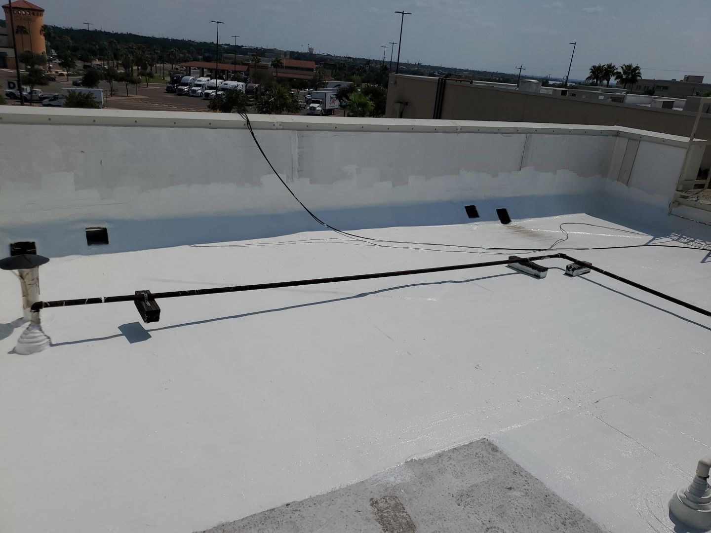Commercial Roofing Repair using Silicon Roof Coating by JM Flores Roofing & Construction, Inc