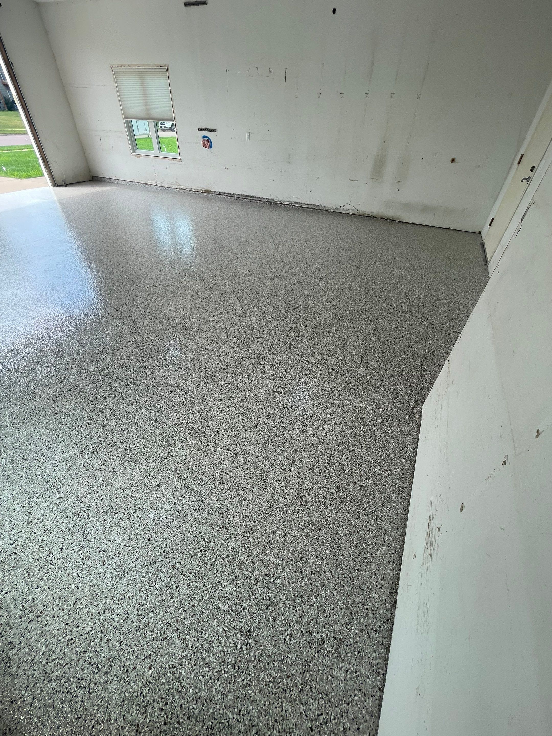 Coyote Flake Concrete Coating for Sioux Falls Garage by Select Painting, Coatings & Garage Cabinets