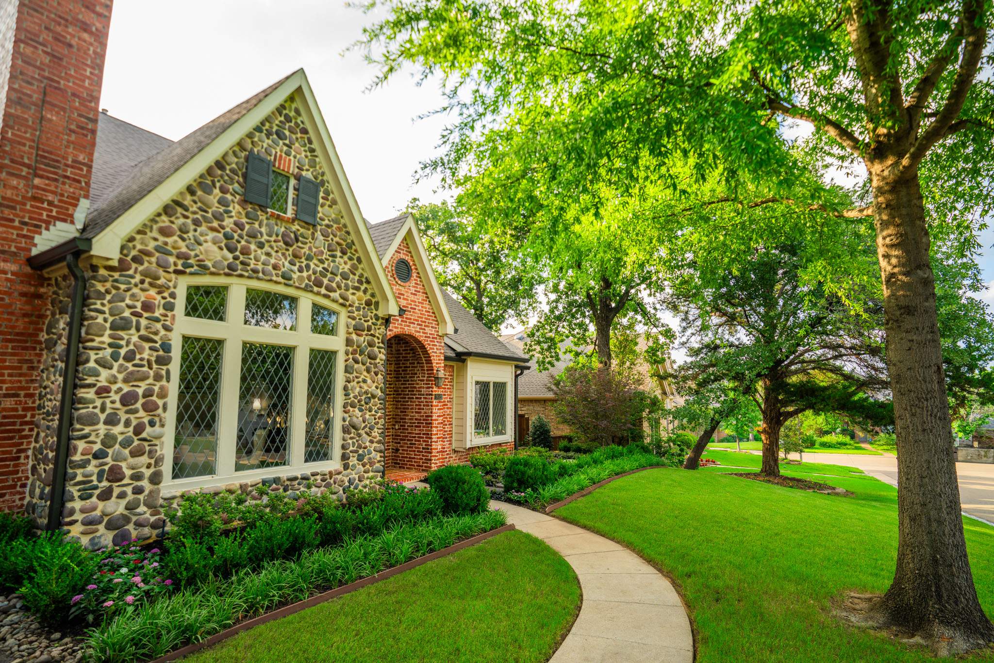 Southern Charm: Revitalizing a Cottage Garden by Complete Exterior Solutions