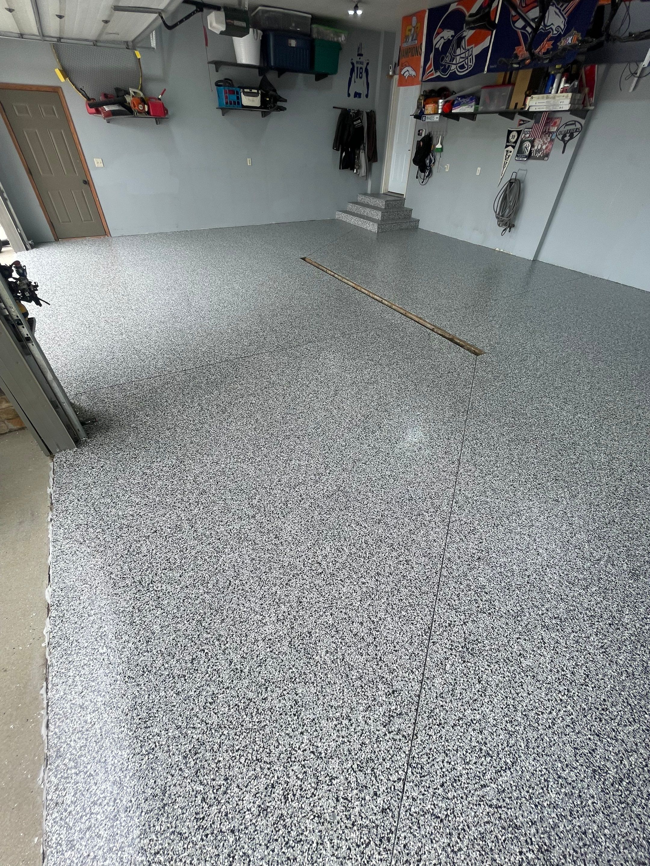 Full Garage Floor Epoxy Coating Installation in Dell Rapids by Select Painting, Coatings & Garage Cabinets